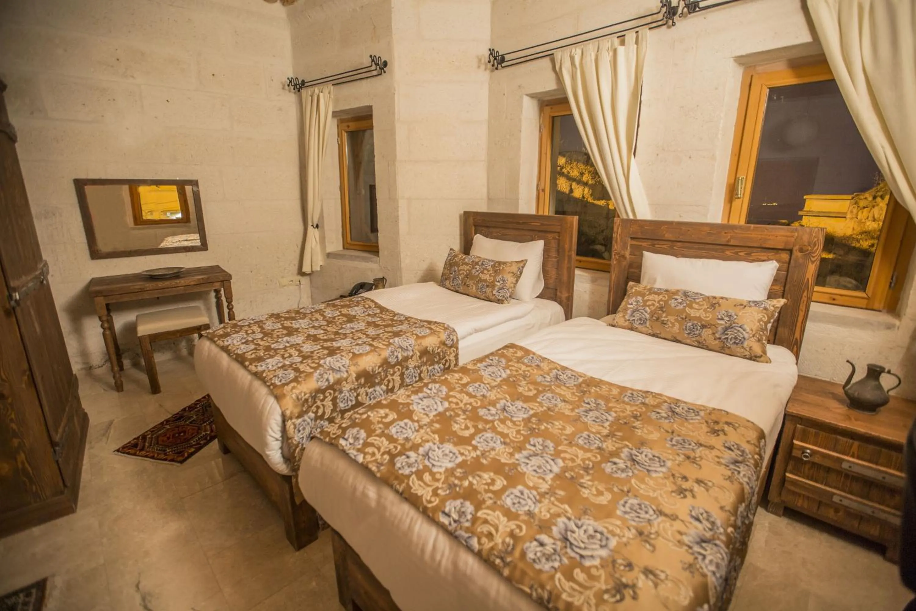 Bed in Helike Cave Suites