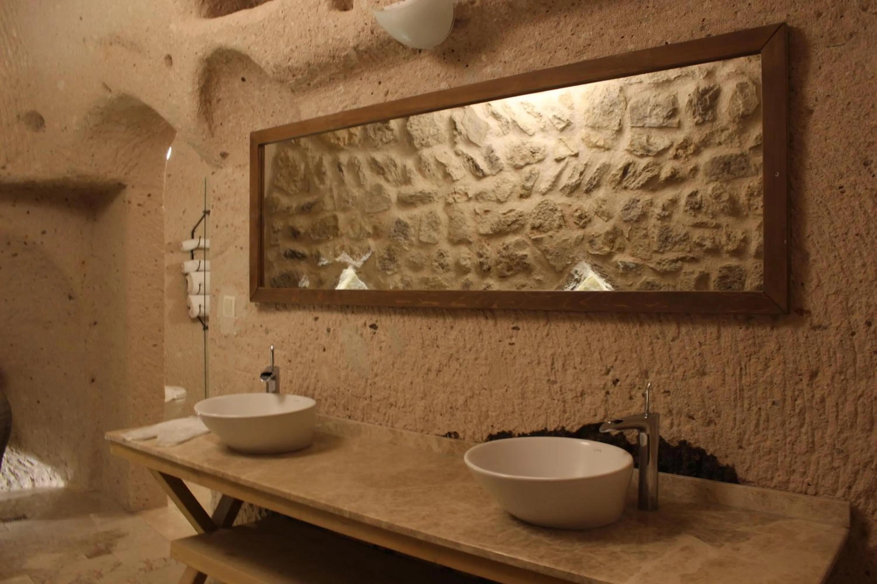 Bathroom in Helike Cave Suites