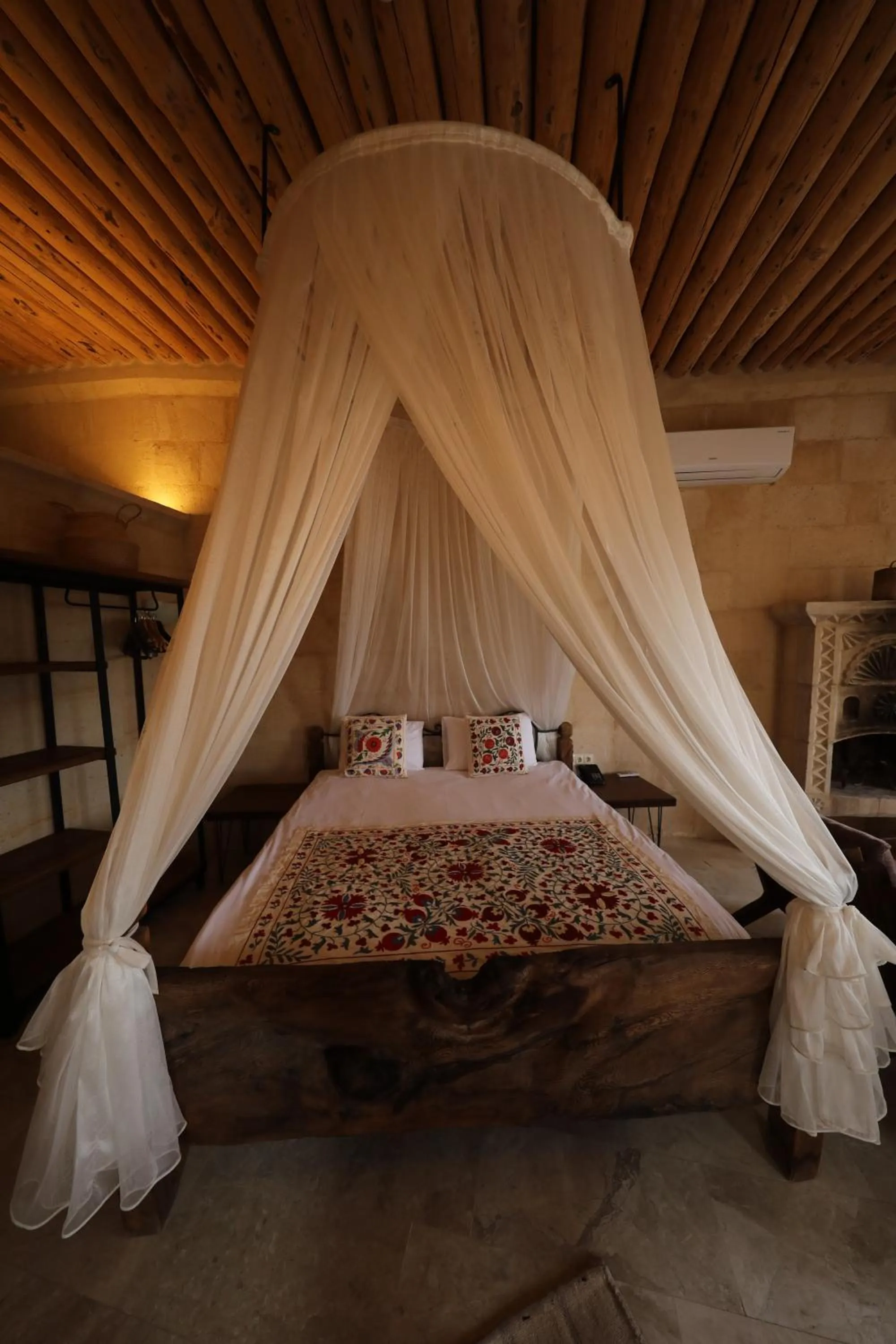 Bed in Helike Cave Suites