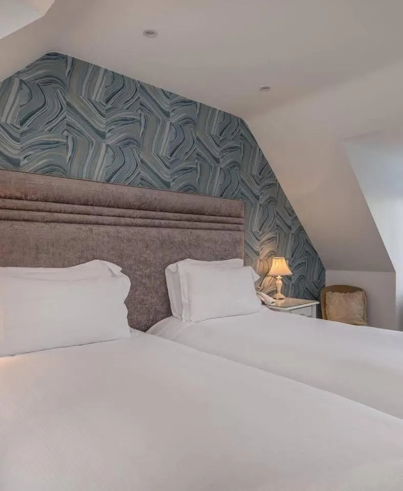 Bed in The Stanwick Hotel