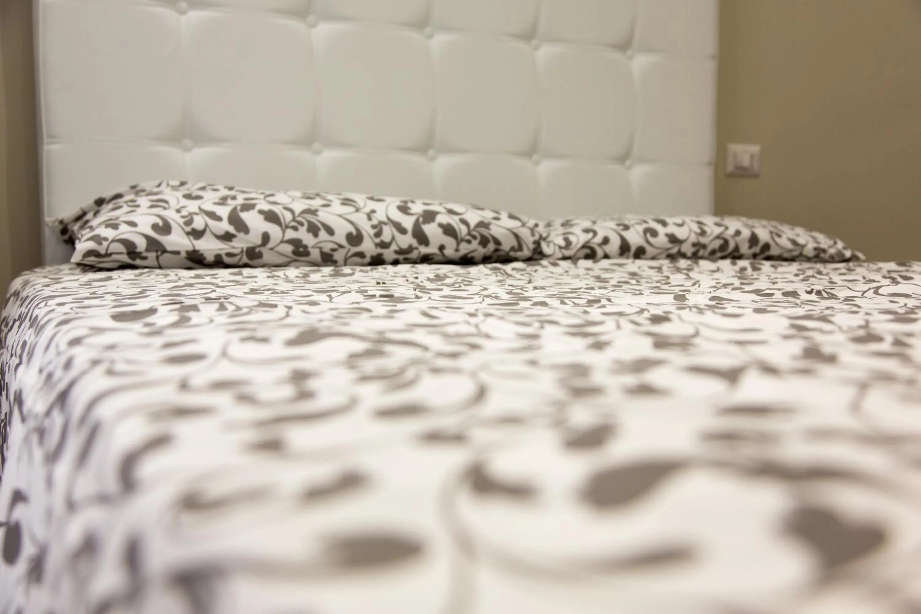 Bed in Venustas Roma Hotel