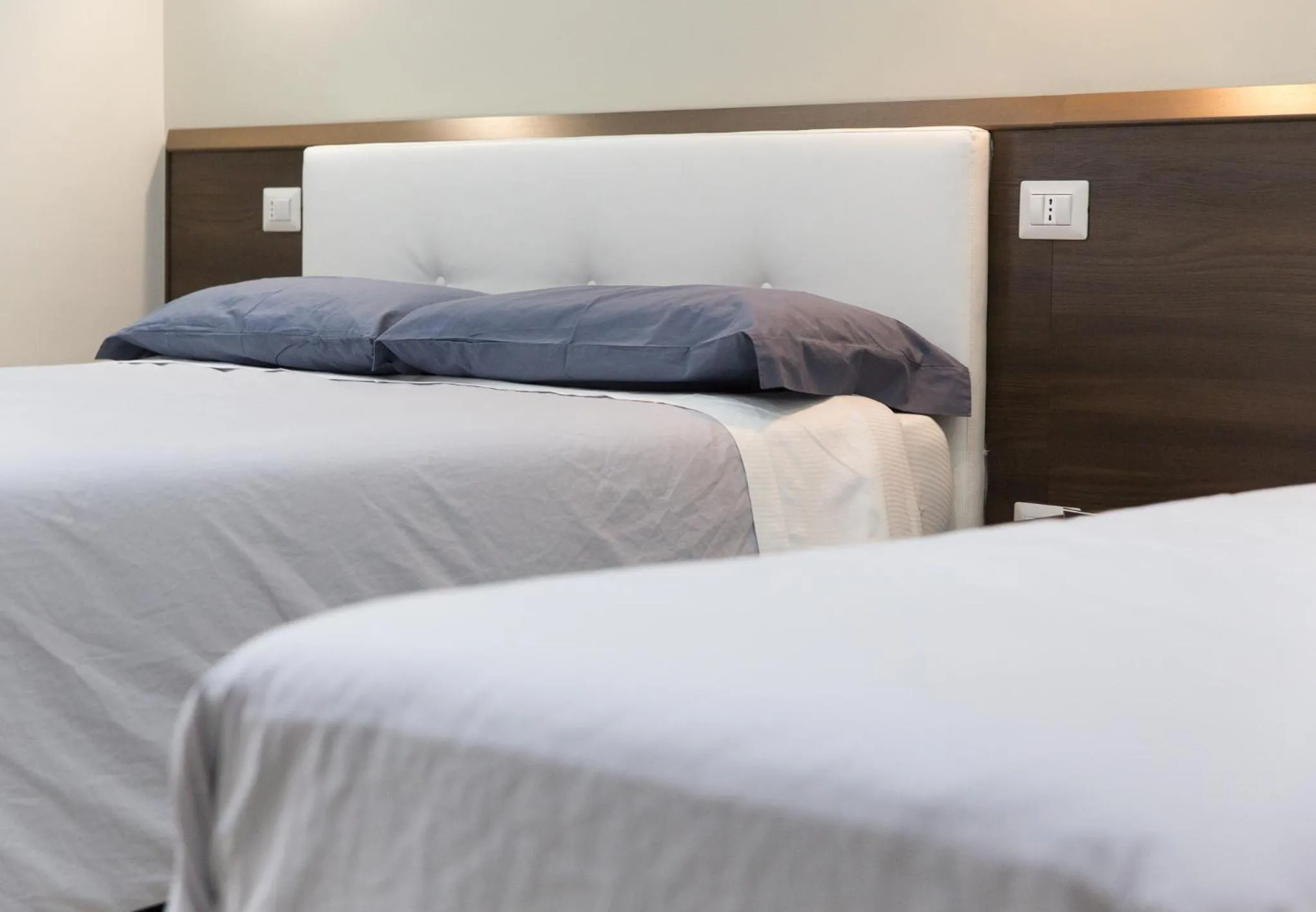 Bed in Venustas Roma Hotel