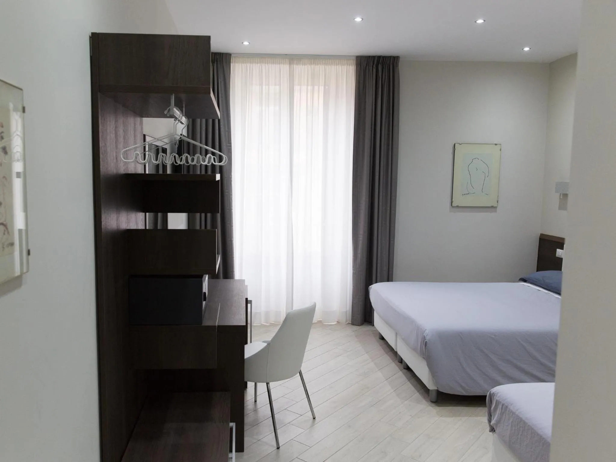 Bed in Venustas Roma Hotel