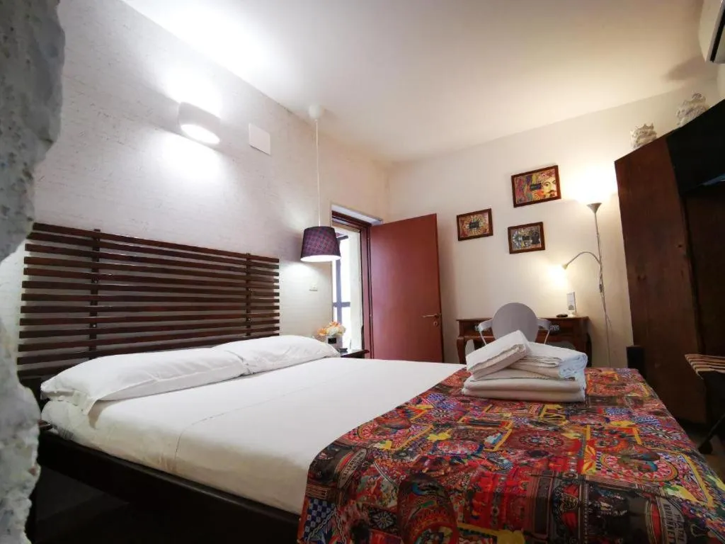 Photo of the whole room, Bed in Del Centro