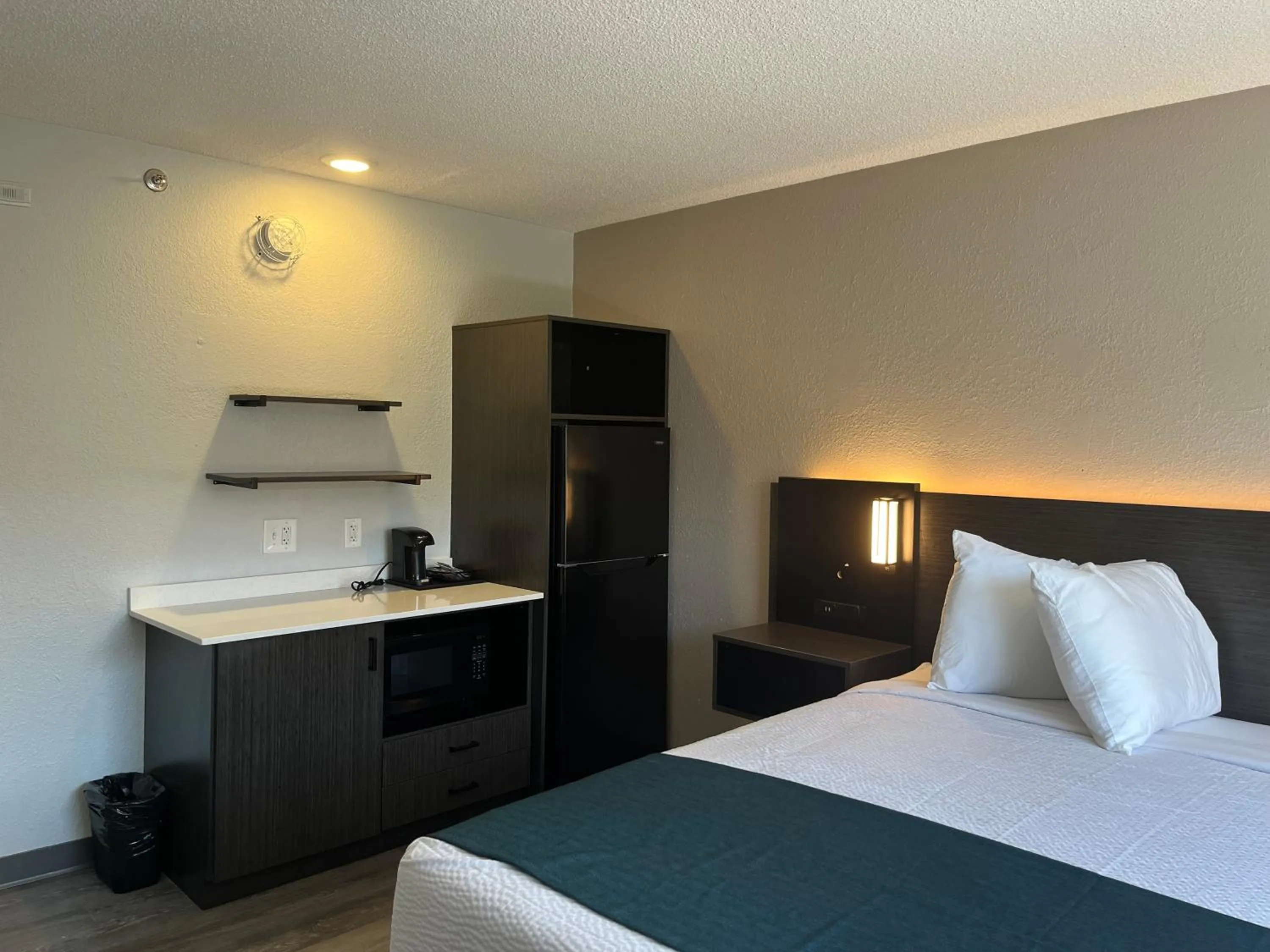 Bed in Studio 6 Suites Norcross, GA