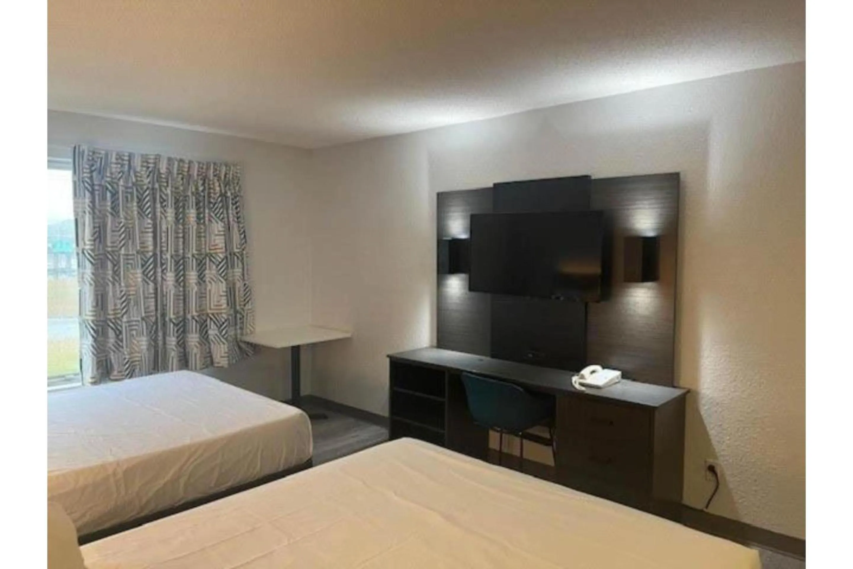 Bedroom, Bed in Studio 6 Suites Norcross, GA