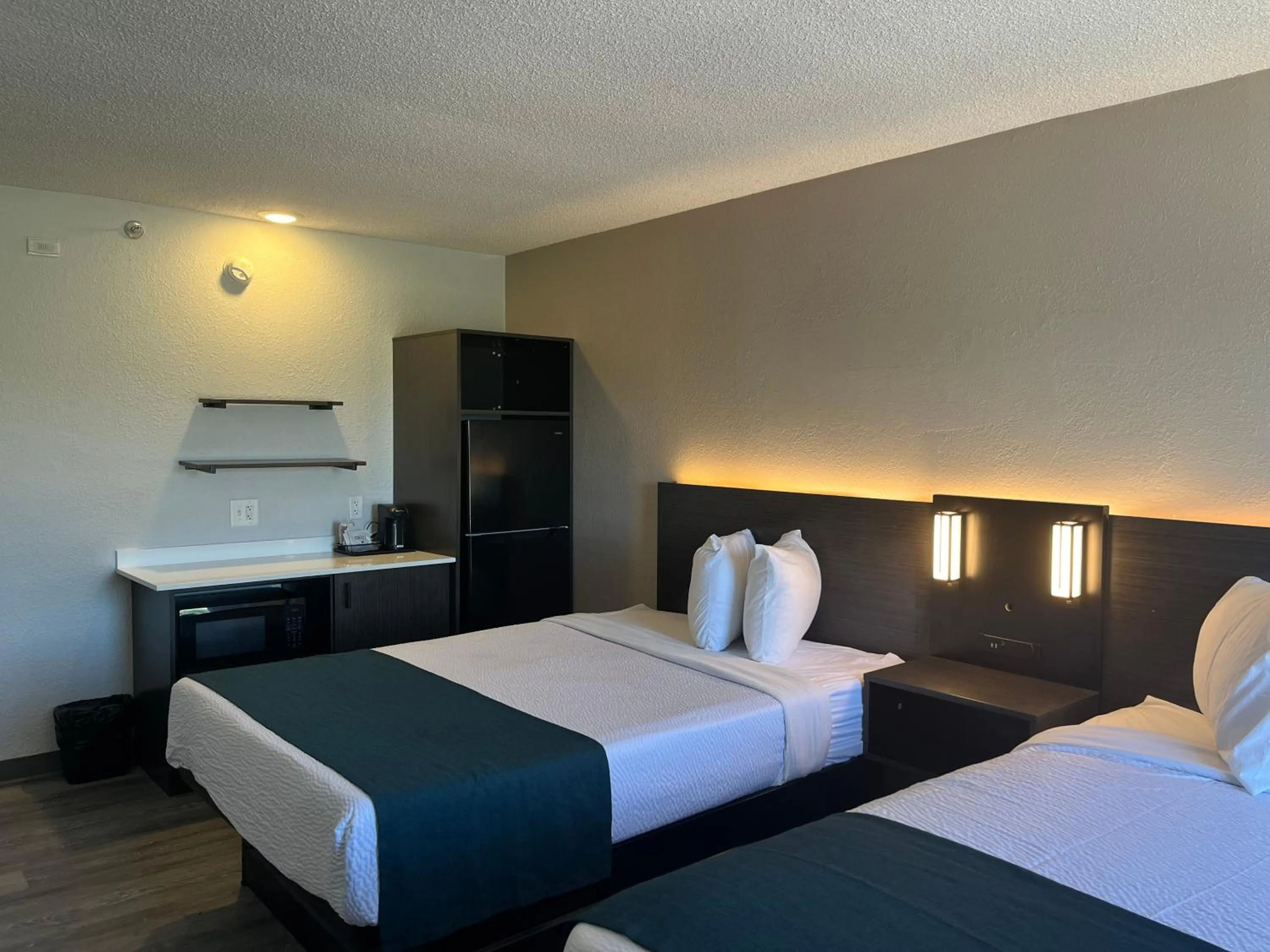 Bed in Studio 6 Suites Norcross, GA