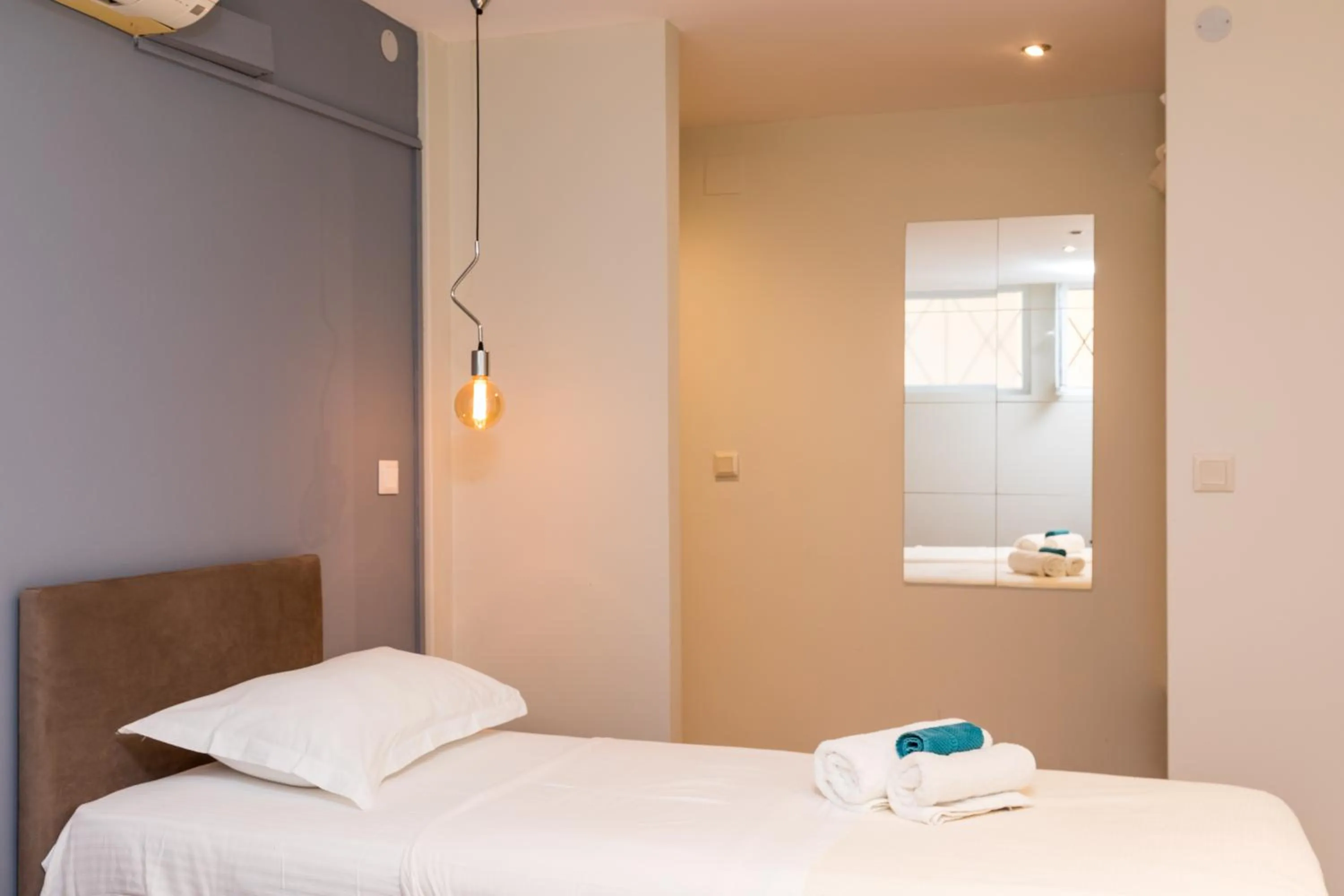 Bed in Mon-Repo Suites