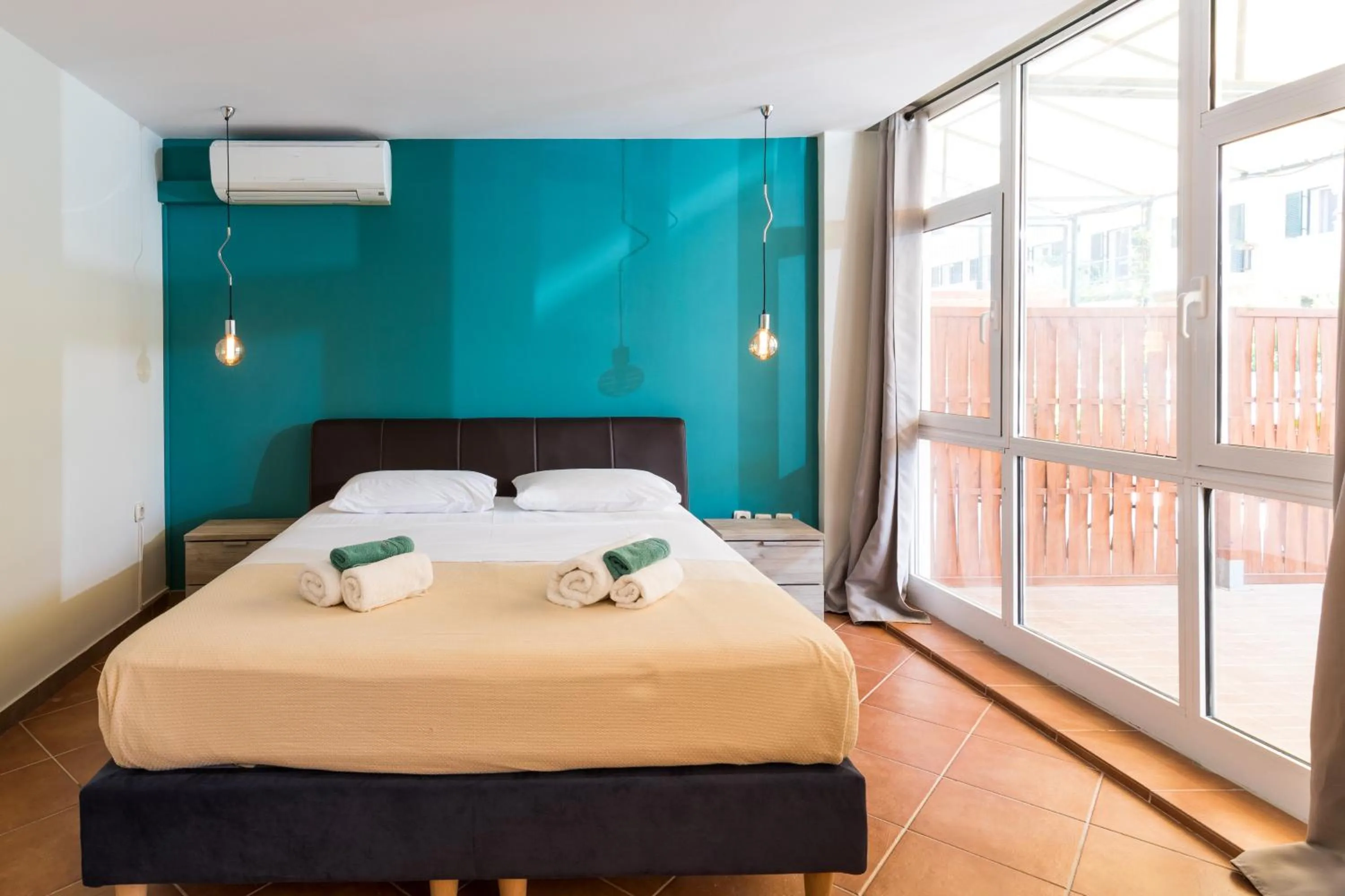 Bed in Mon-Repo Suites