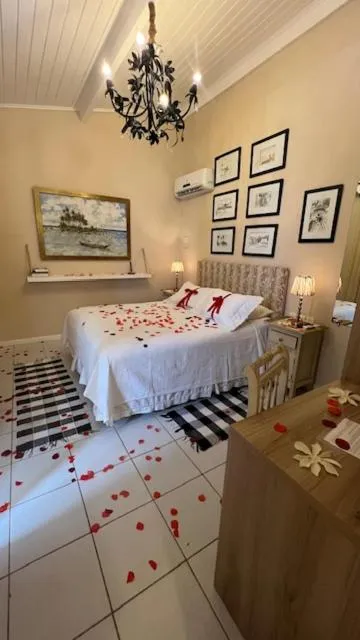 Bed in Pousada Via Brasil