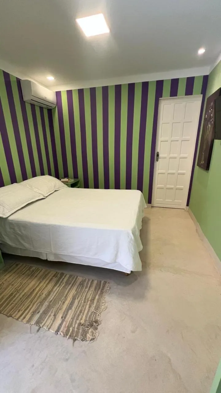 Bed in Pousada Via Brasil