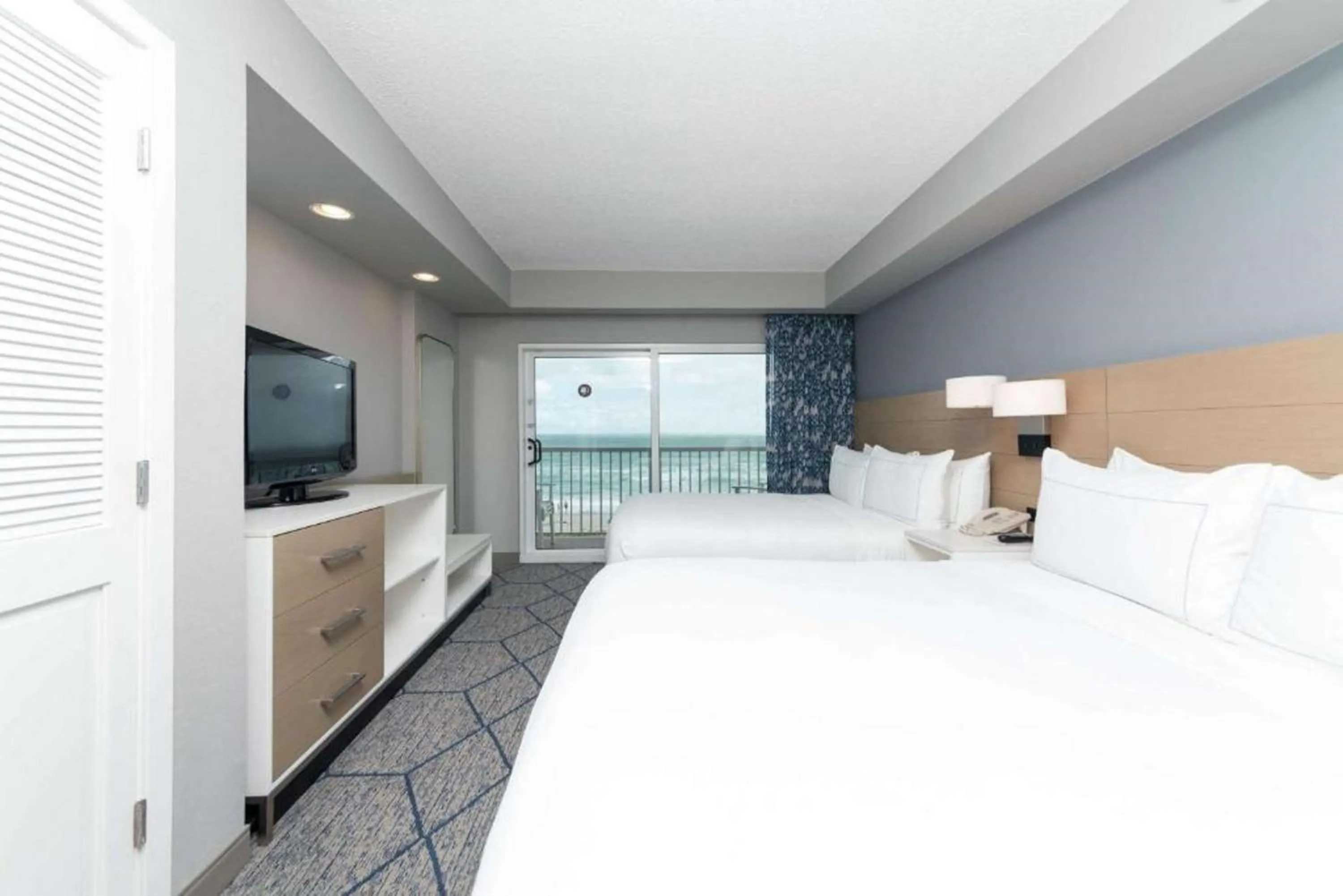Bed in DoubleTree Suites by Hilton Melbourne Beach Oceanfront