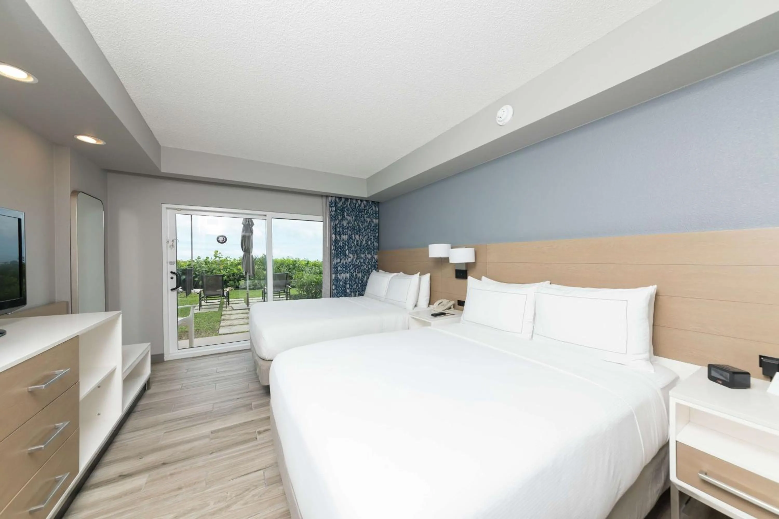 Bed in DoubleTree Suites by Hilton Melbourne Beach Oceanfront