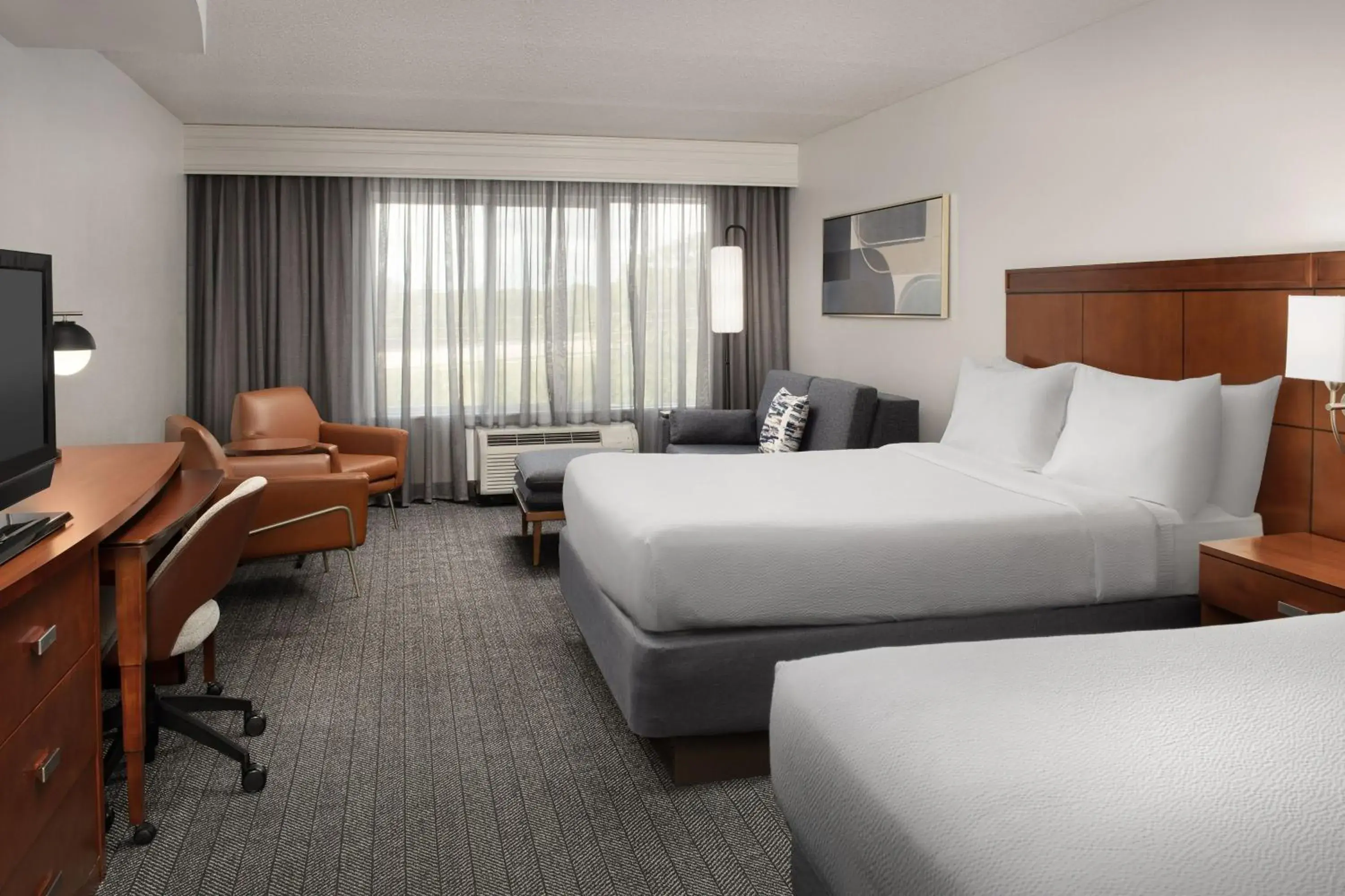 Larger Queen Room with Two Queen Beds and Sofa Bed in Courtyard Jacksonville Flagler Center Larger Queen Room with Two Queen Beds and Sofa Bed in Courtyard Jacksonville Flagler Center
