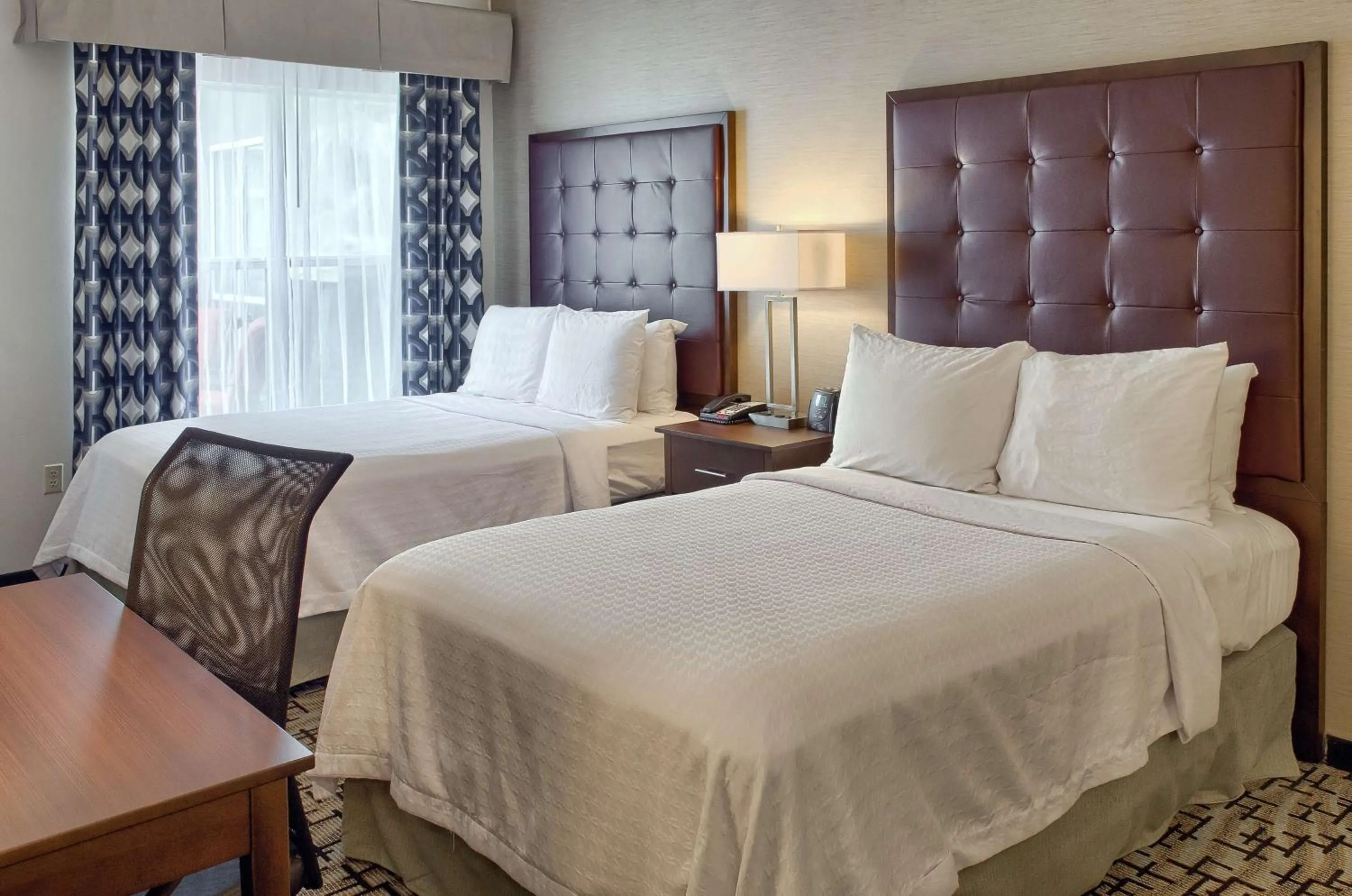 Bed in Homewood Suites by Hilton Mobile Airport-University Area