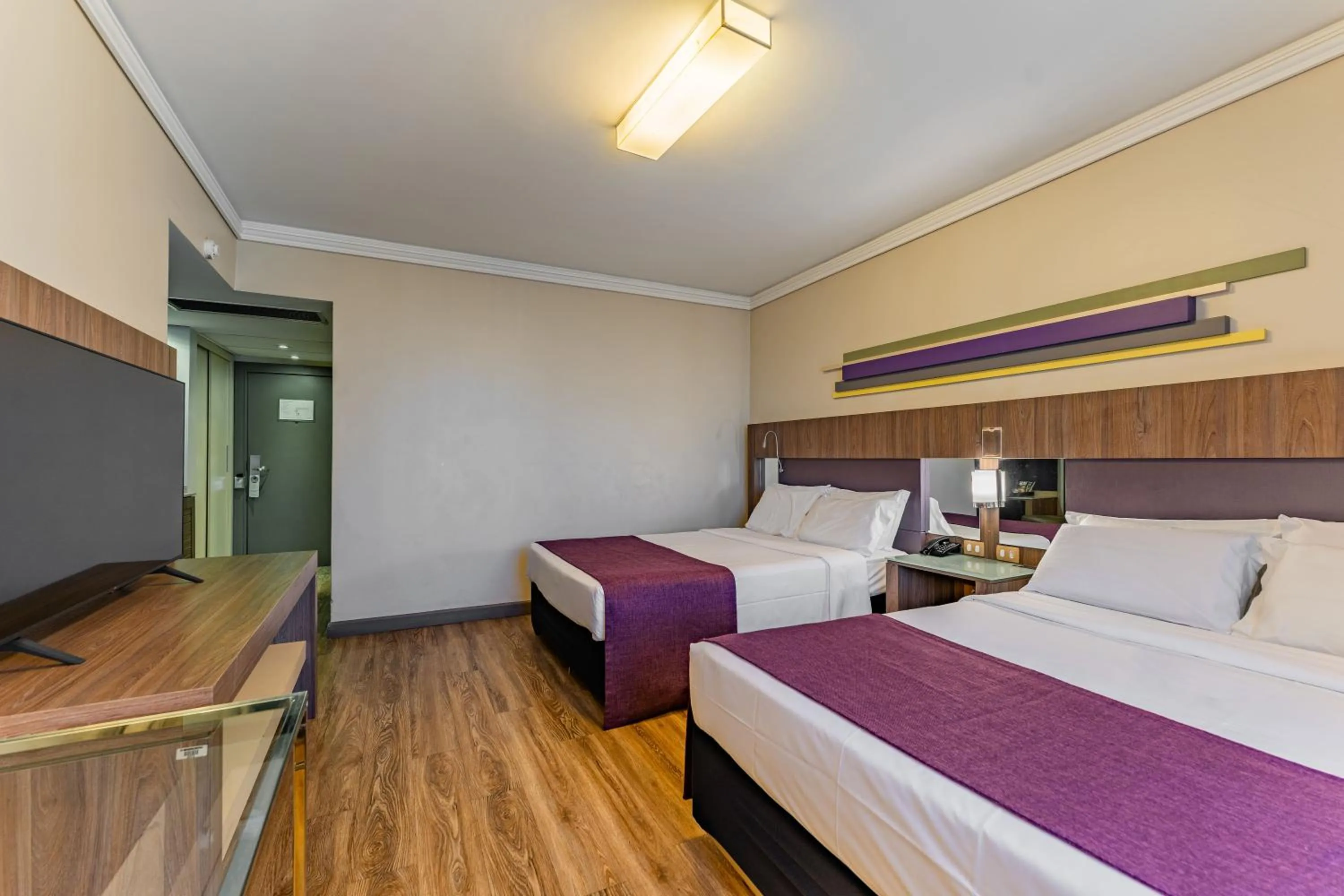 Bed in Grand Mercure Curitiba Rayon