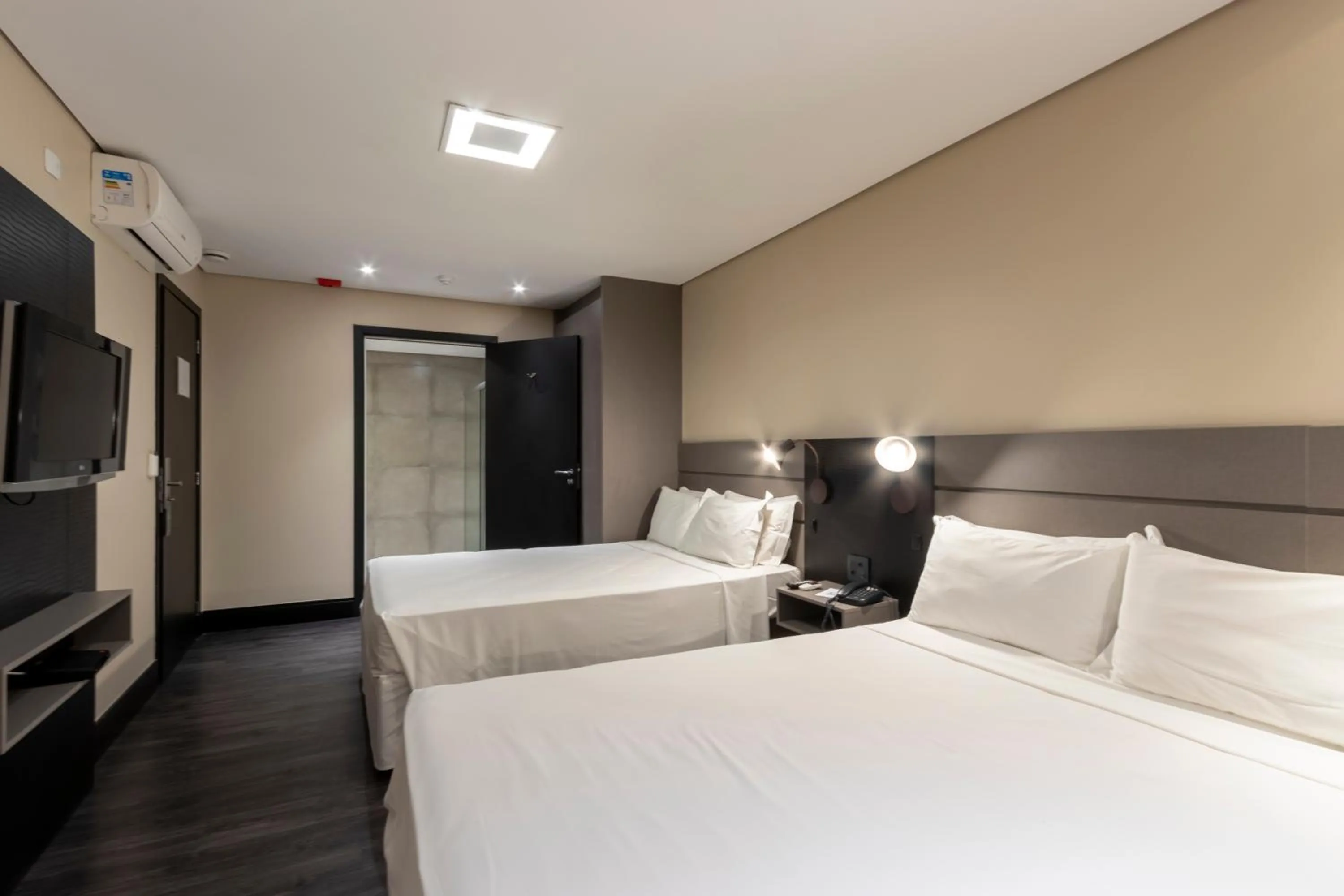 Bed in Grand Mercure Curitiba Rayon