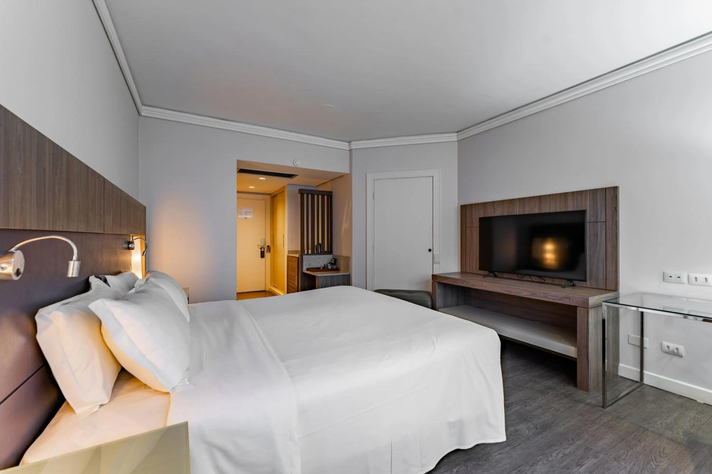 Bed in Grand Mercure Curitiba Rayon