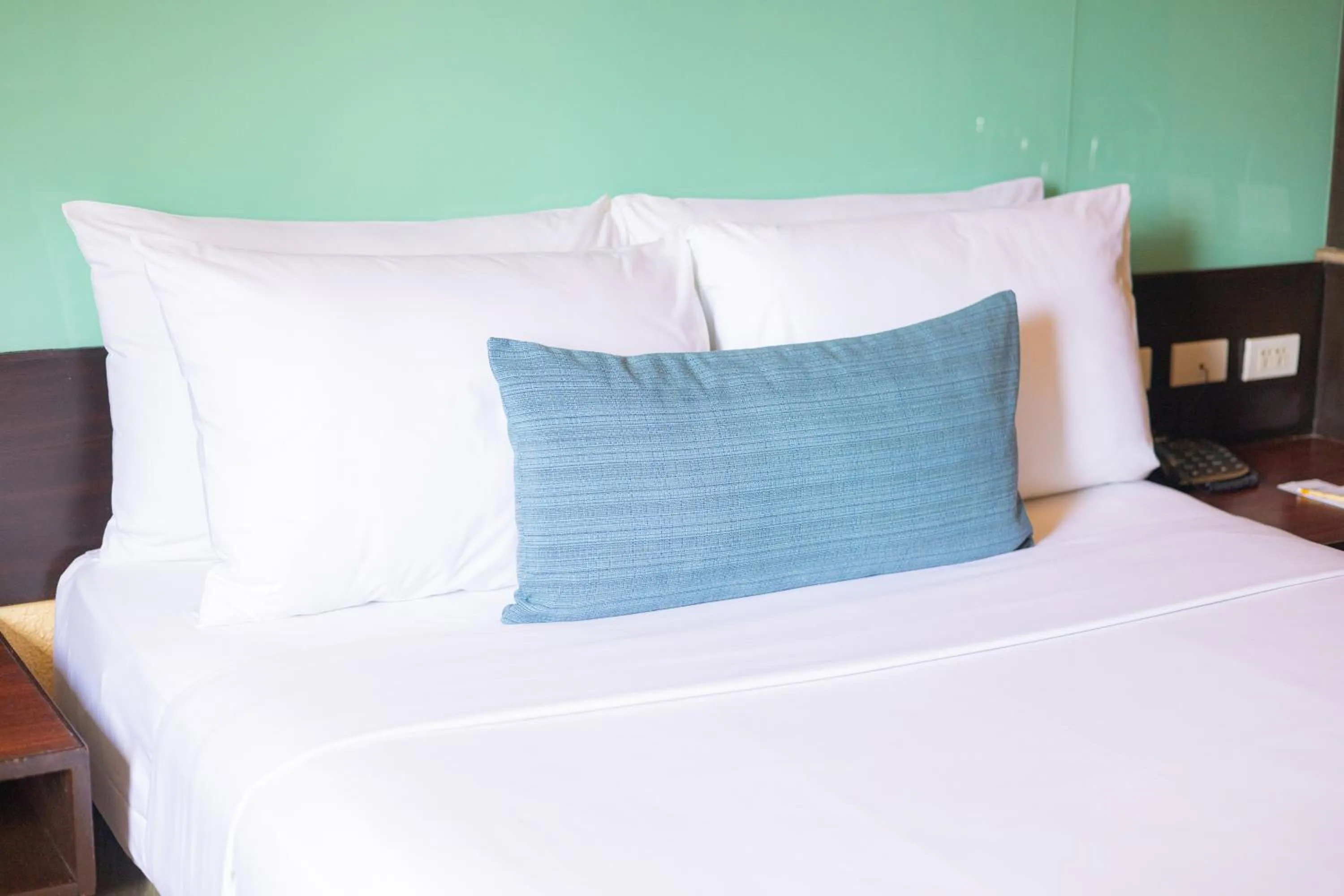 Bed in Microtel by Wyndham Cabanatuan