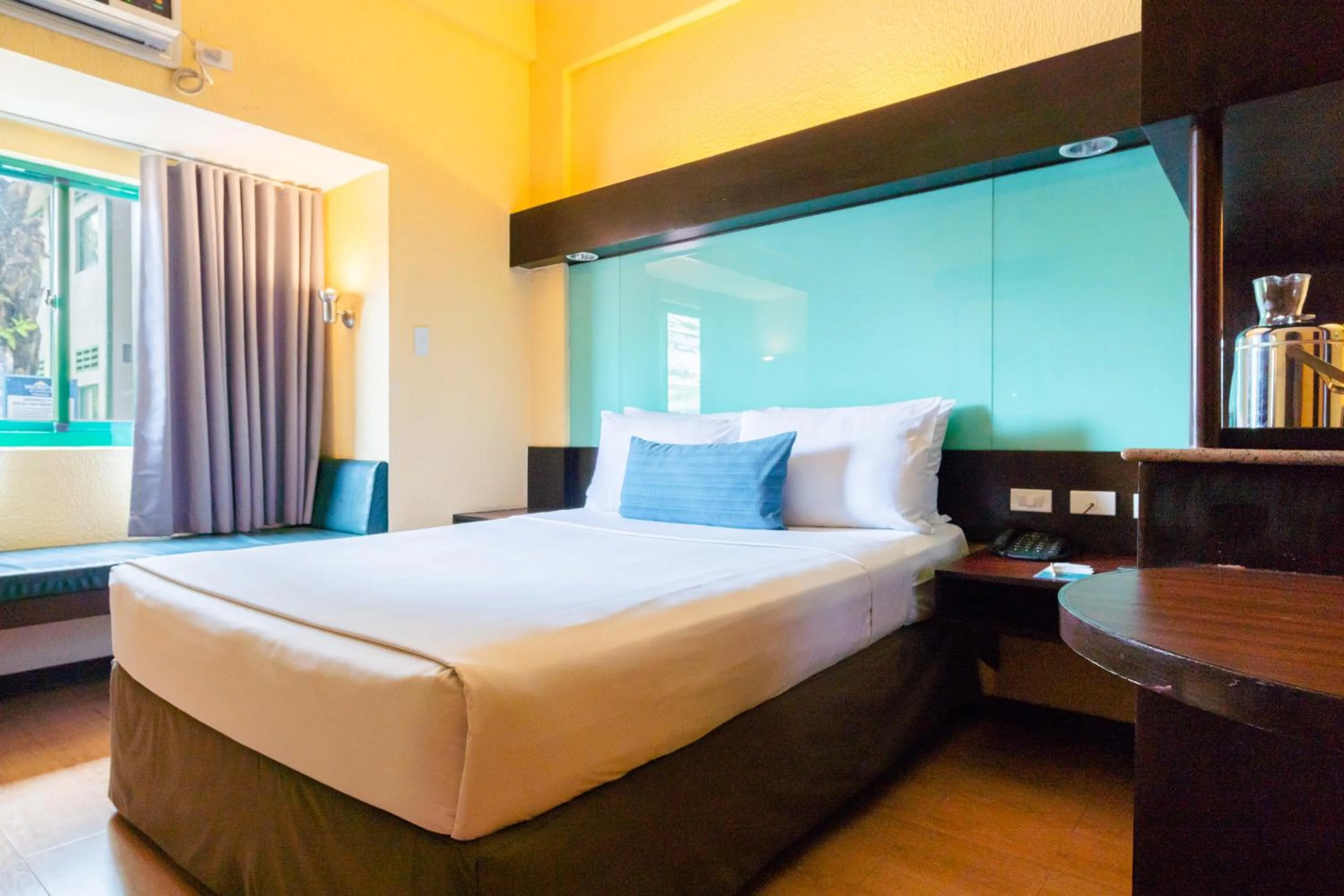 Bed in Microtel by Wyndham Cabanatuan