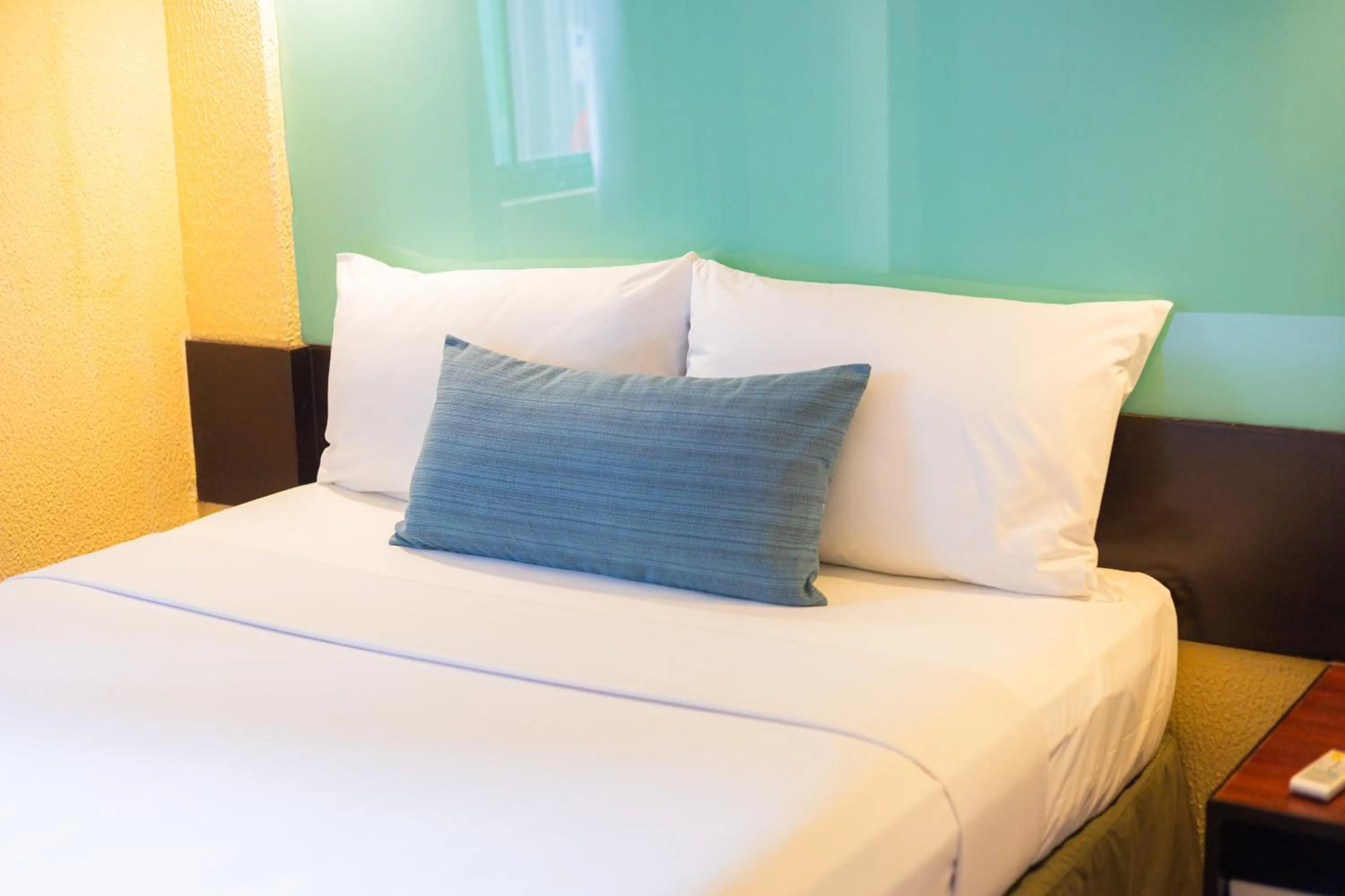 Bed in Microtel by Wyndham Cabanatuan