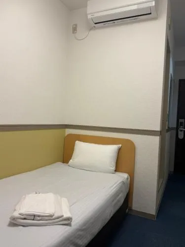 Bed in Business Hotel Legato