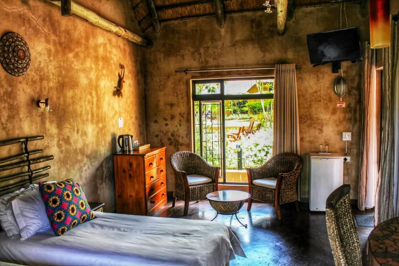 Photo of the whole room, Bed in AmaZulu Lodge