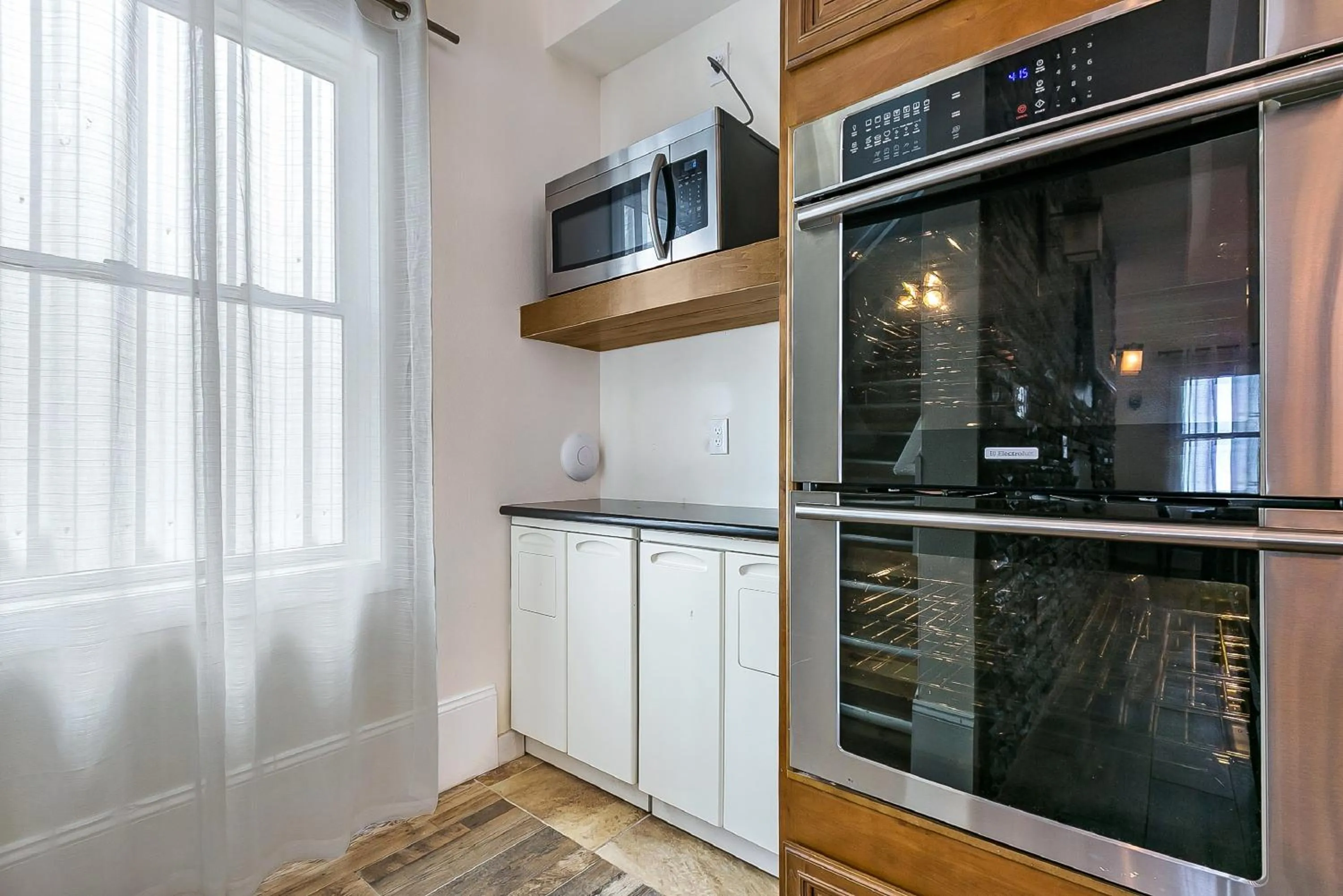 Kitchen or kitchenette in Urban Condos with Spacious Rooms & Amenities