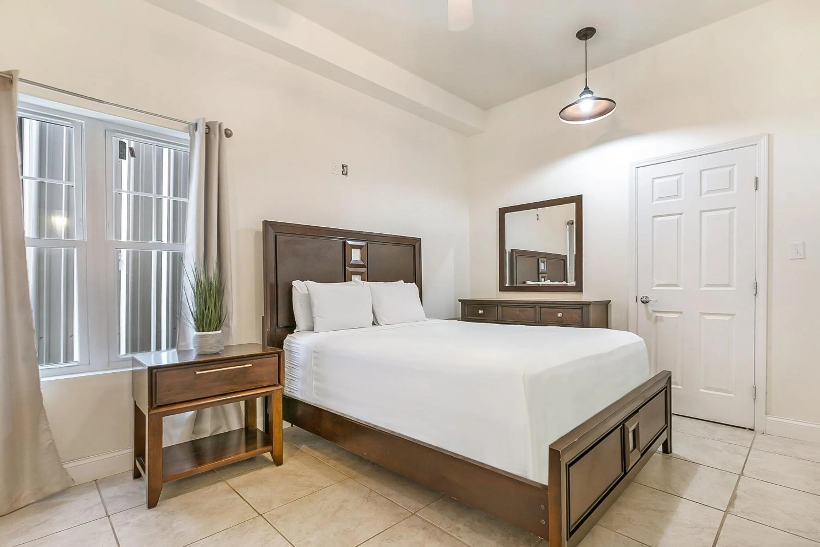 Bedroom, Bed in Urban Condos with Spacious Rooms & Amenities