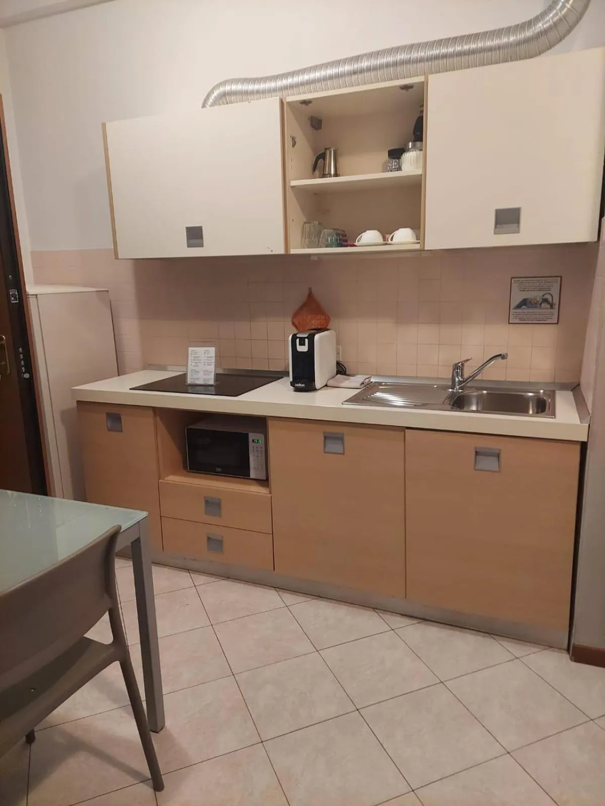 Kitchen or kitchenette in Verona Class ApartHotel "Residenze del Cuore"