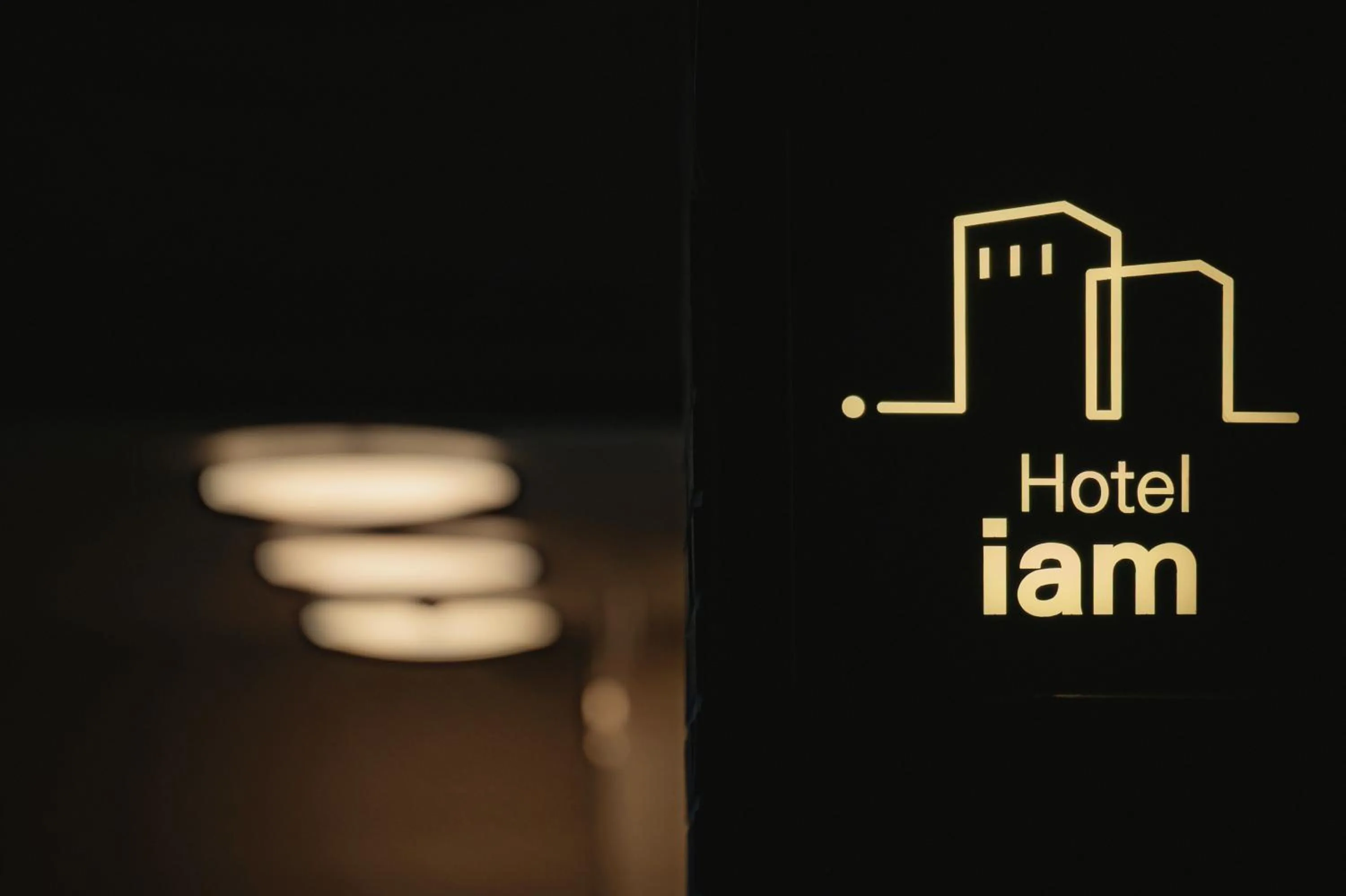 Property logo or sign in Hotel Iam