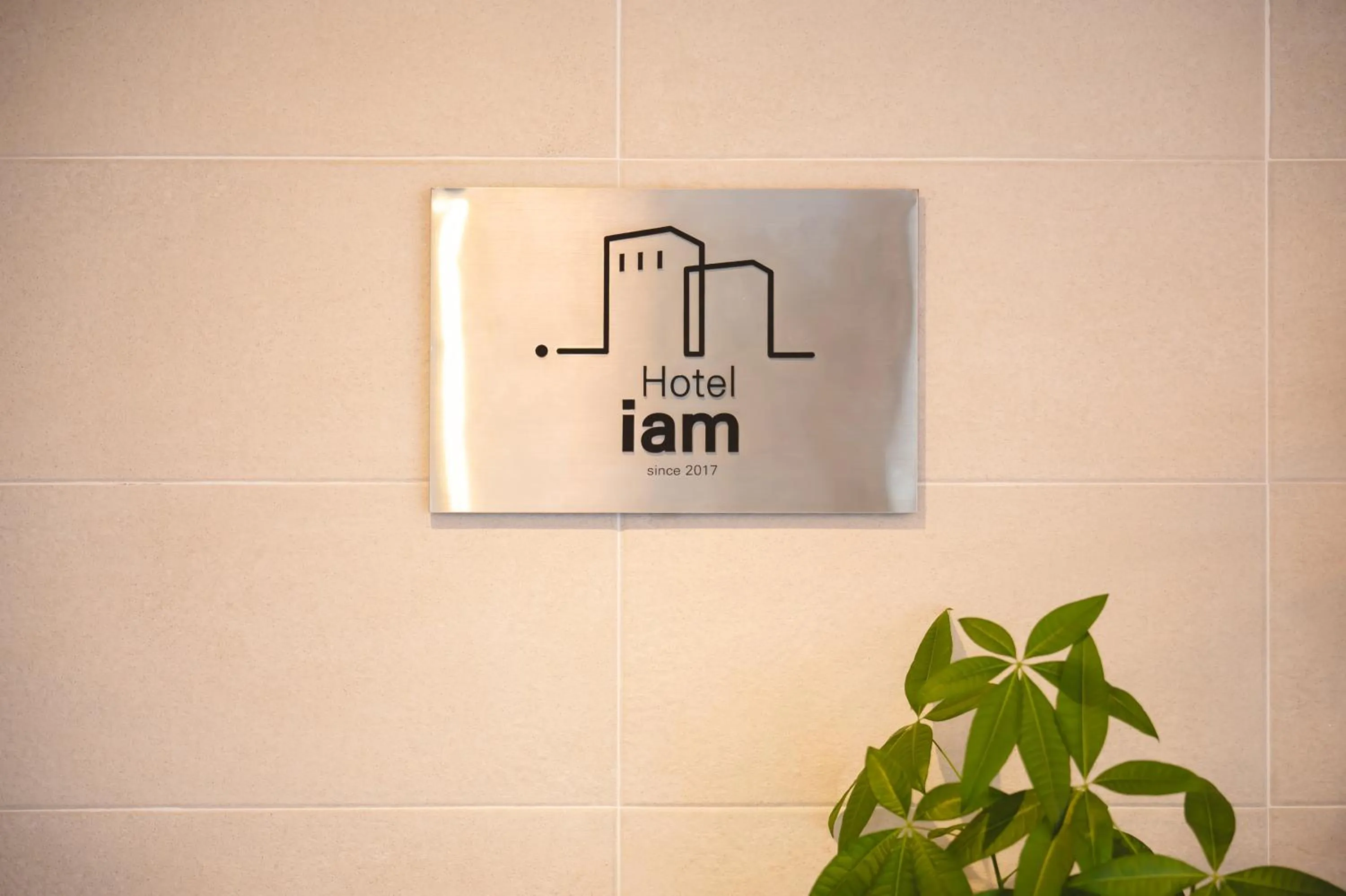 Property logo or sign in Hotel Iam