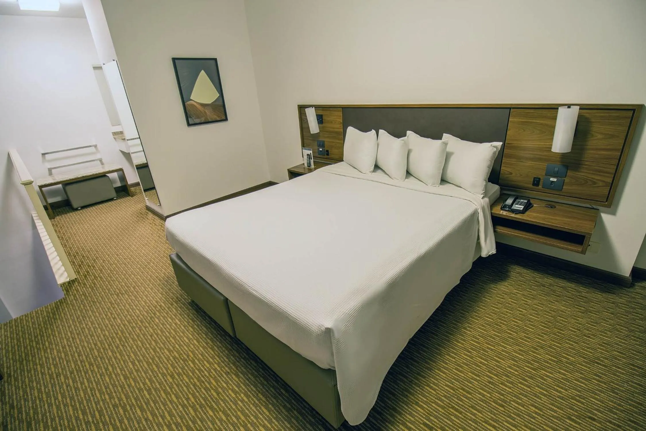 Bed in Hotel Deville Curitiba