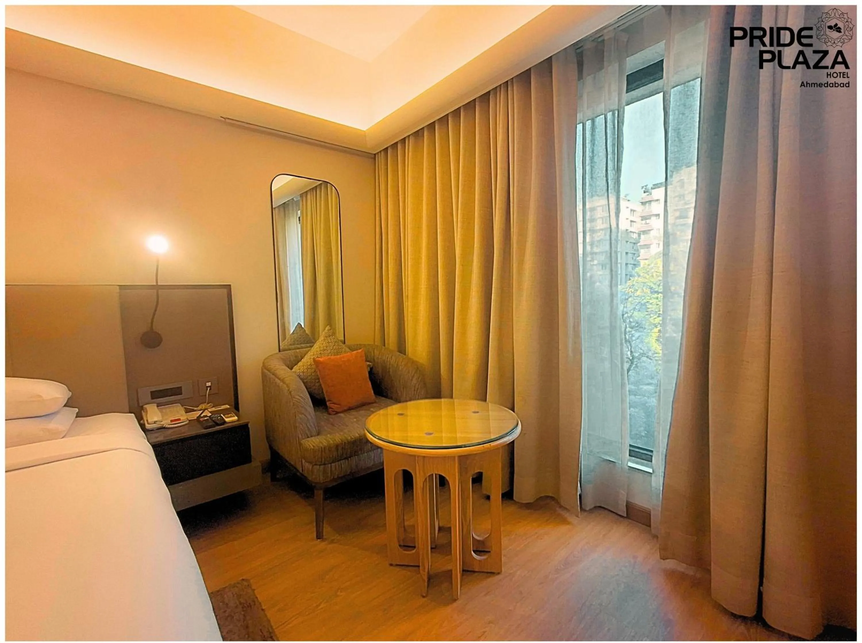 Photo of the whole room, Bed in Pride Plaza Hotel, Ahmedabad