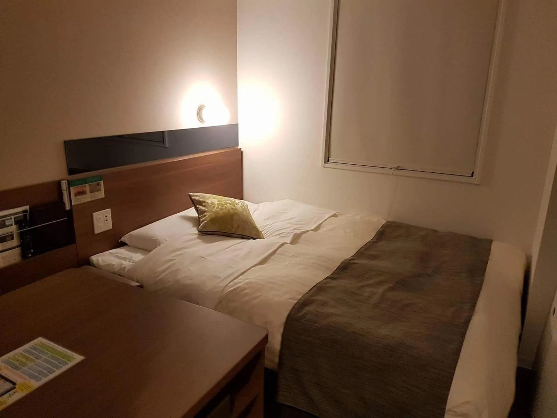 Bed in Super Hotel Premier Hakataeki