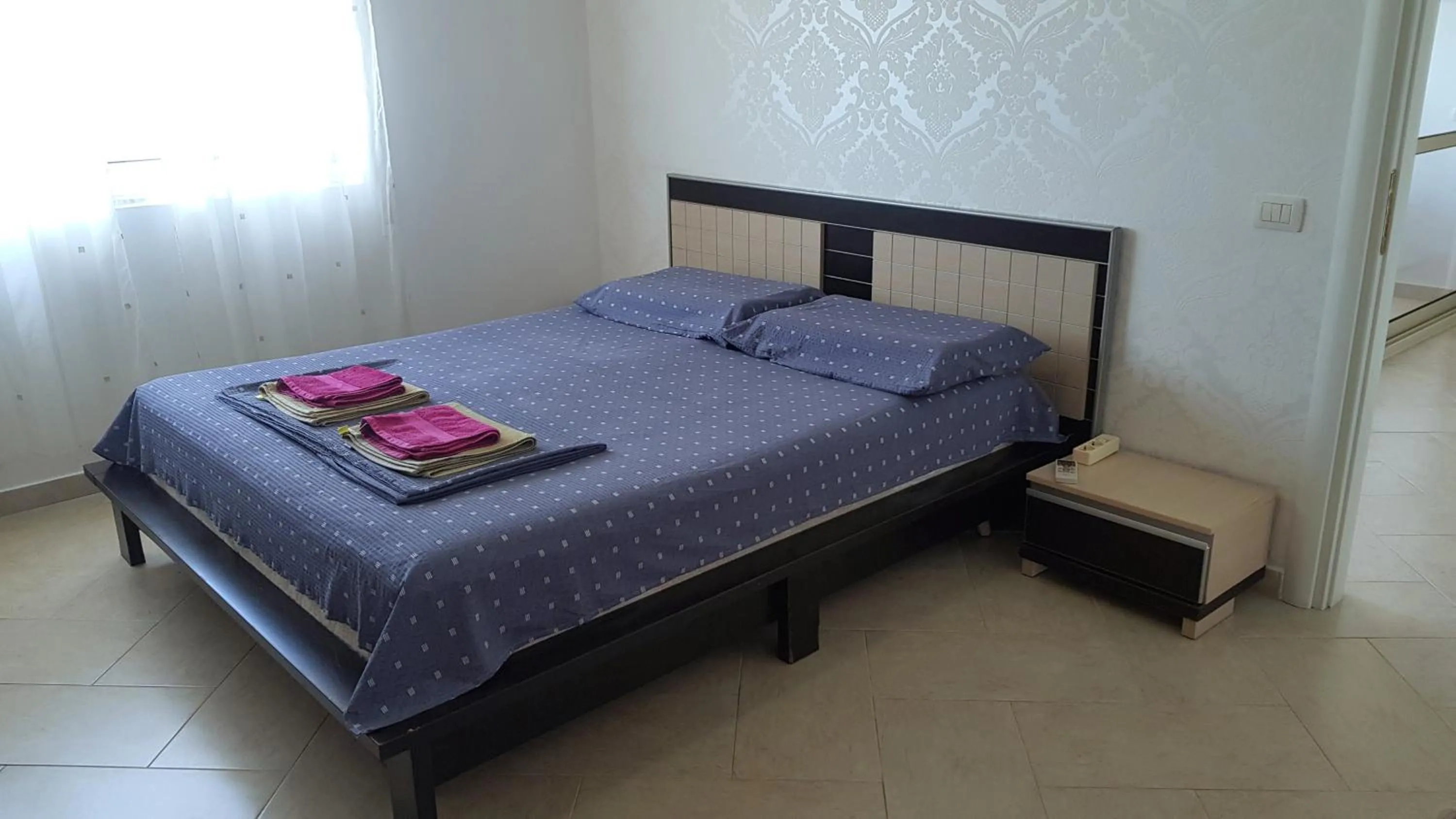 Bed in M&I Beach Apartment with Sea View