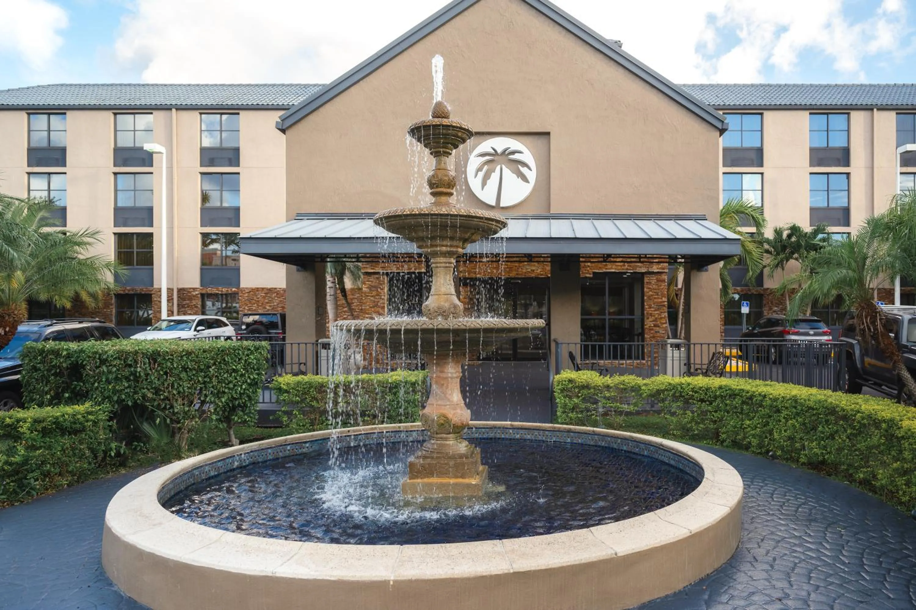 Facade/entrance in The Palms Inn & Suites Miami, Kendall, FL
