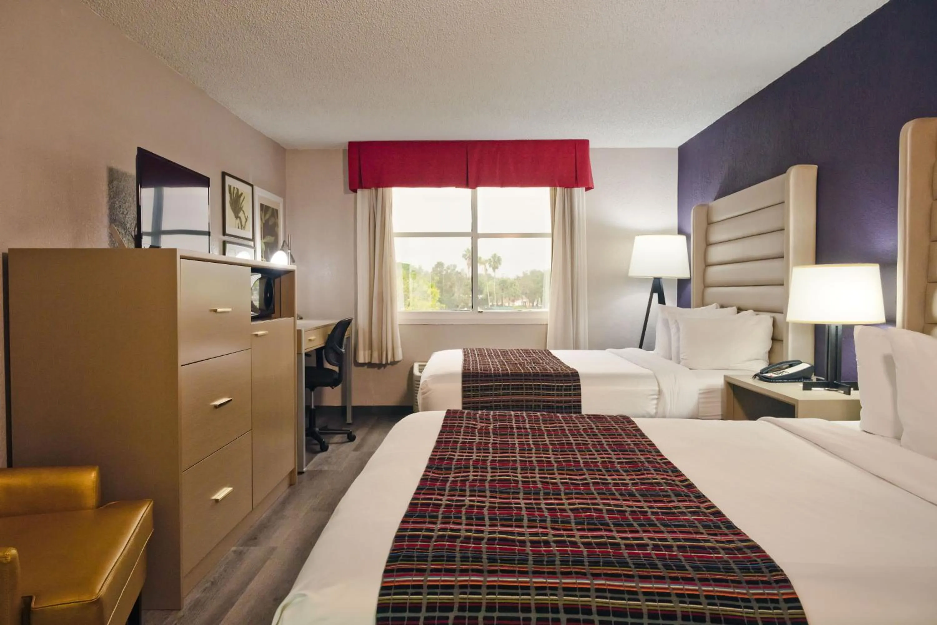 Bedroom, Bed in The Palms Inn & Suites Miami, Kendall, FL