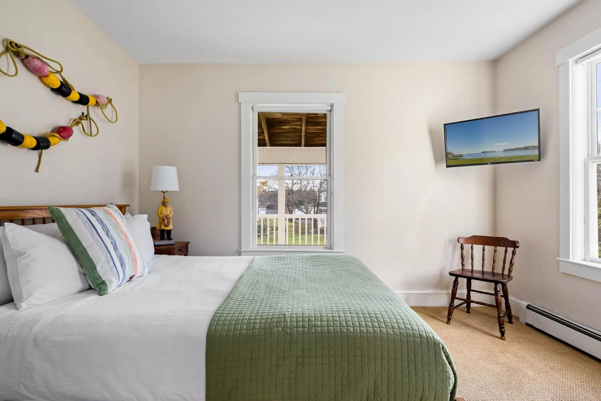 Bed in East Wind Inn & Suites