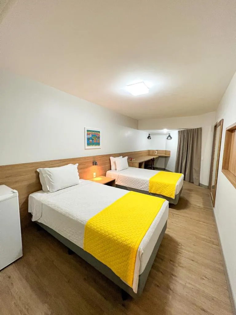 Bed in San Marino Suite Hotel