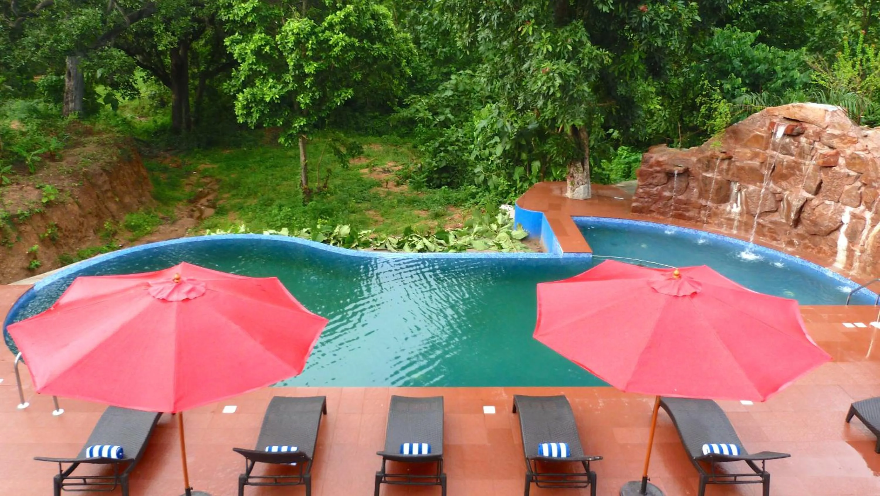 Swimming pool in The Riverwood Forest Retreat Pench