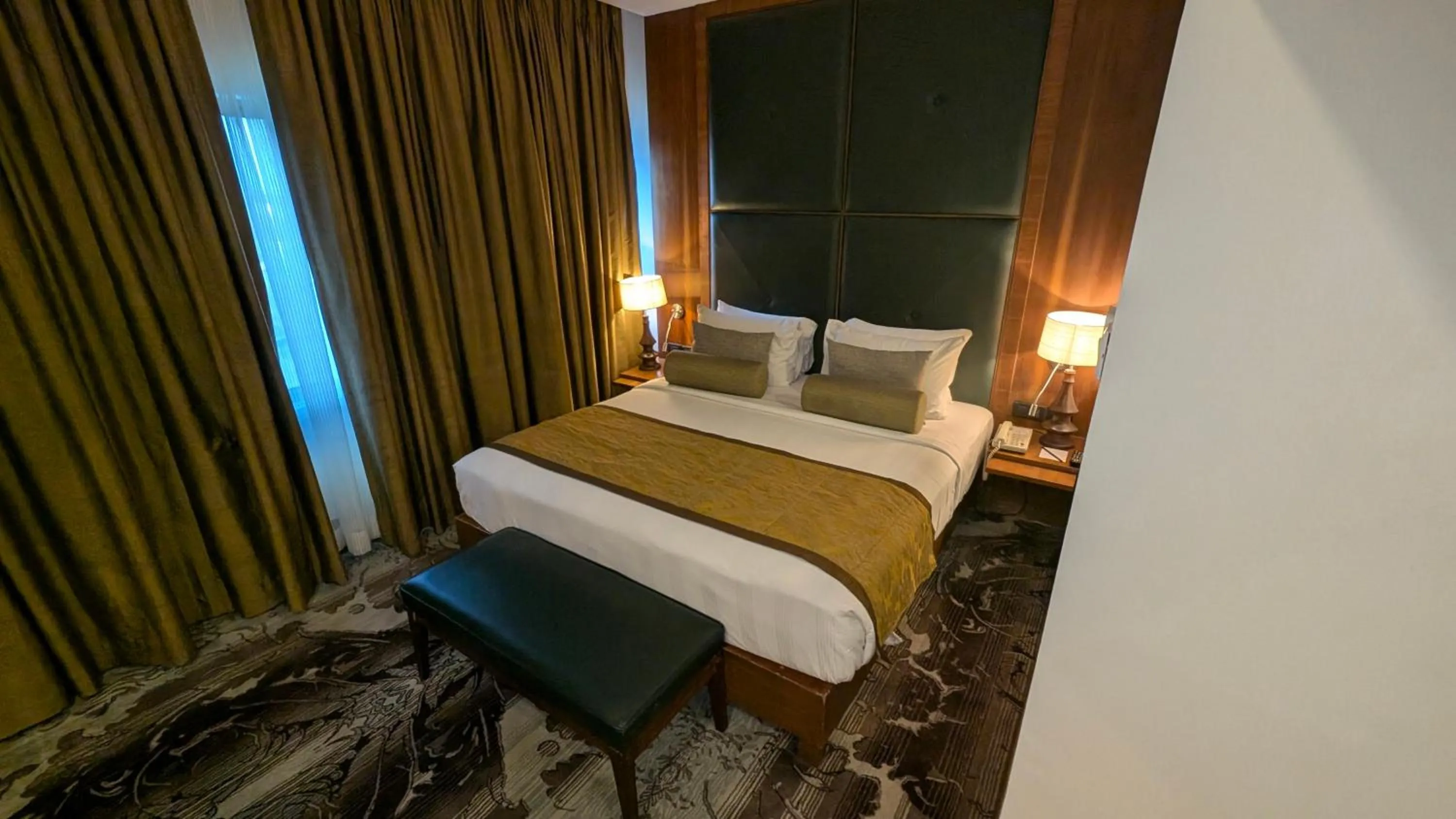 Bed in Pride Hotel, Chennai