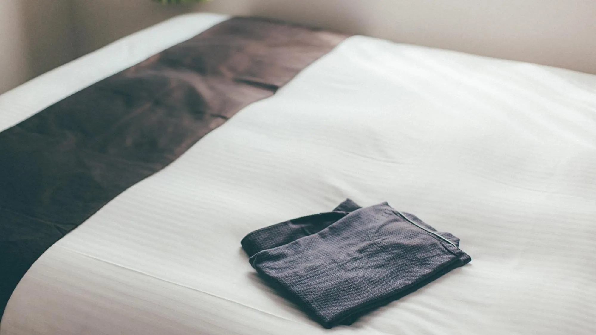 Bed in Kuretake Inn Premium Nagoya Nayabashi