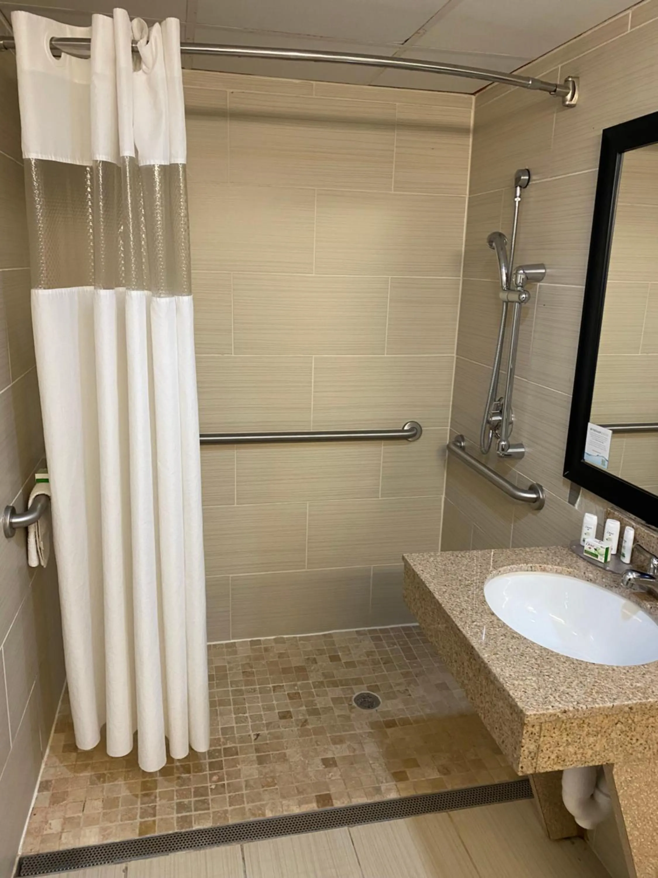 Bathroom in Ramada by Wyndham Rochelle Park Near Paramus