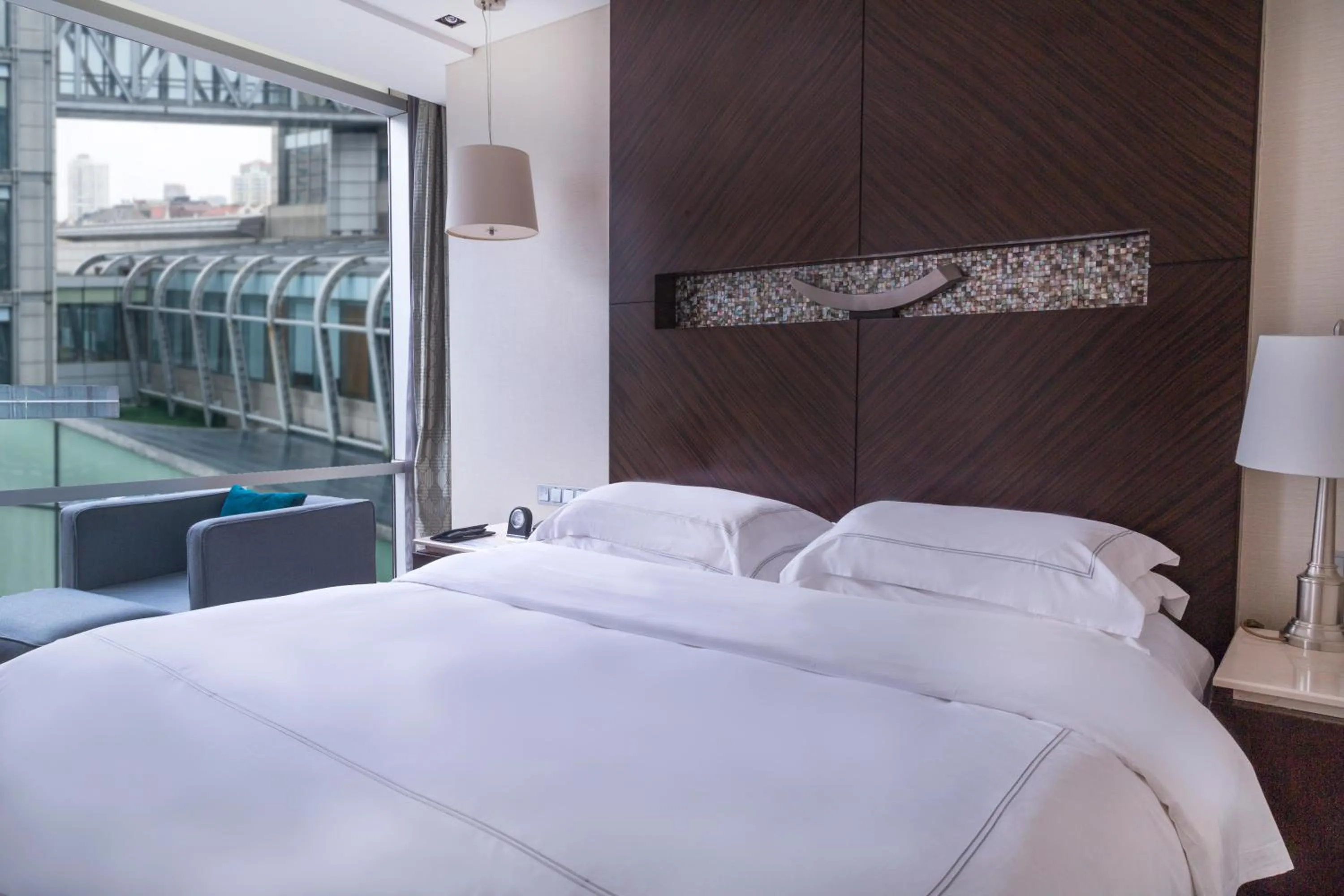 Bed in InterContinental Qingdao by IHG l Inside the Olympic Sailing Center l May Fourth Square
