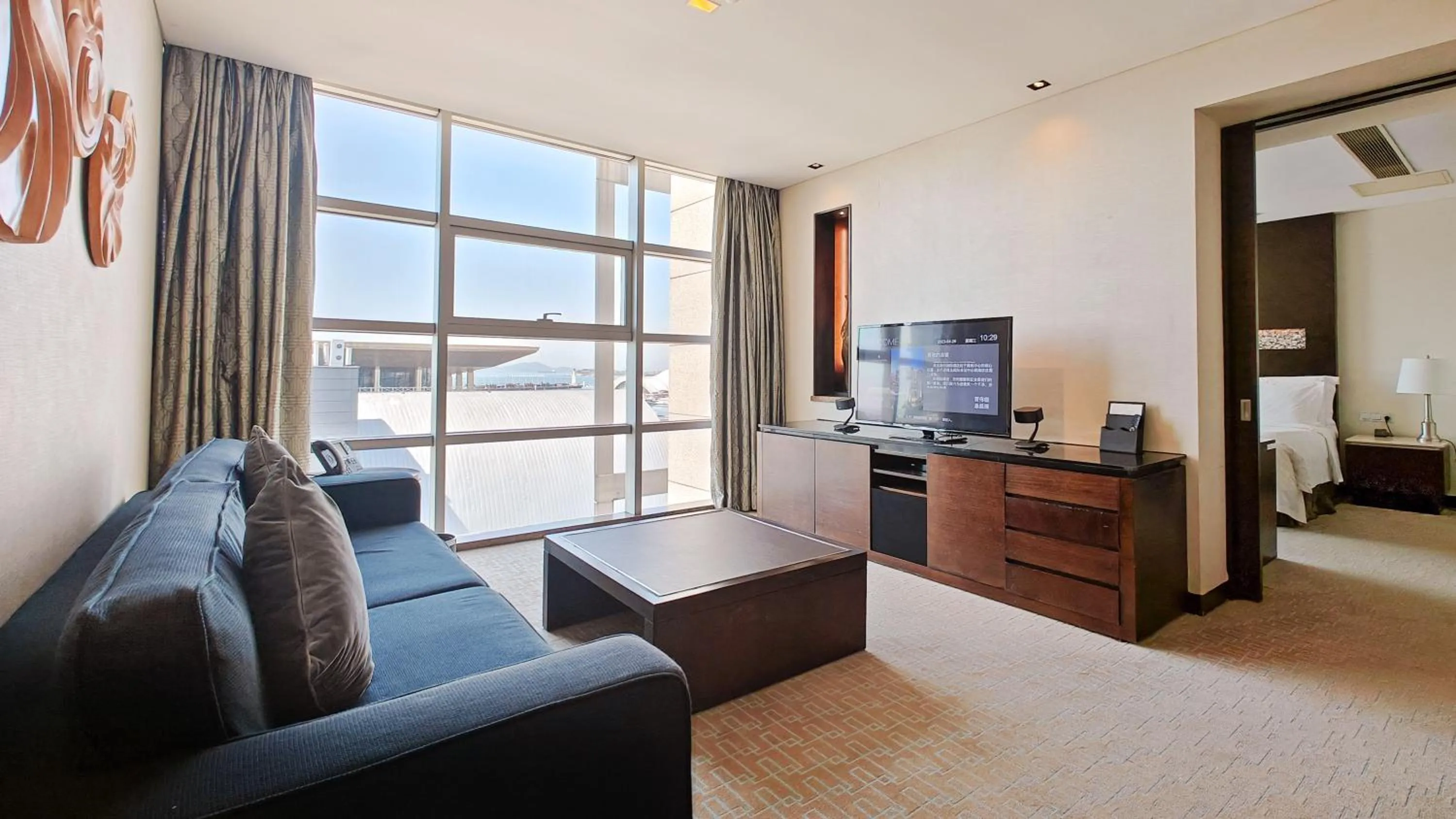 Living room, Bed in InterContinental Qingdao by IHG l Inside the Olympic Sailing Center l May Fourth Square