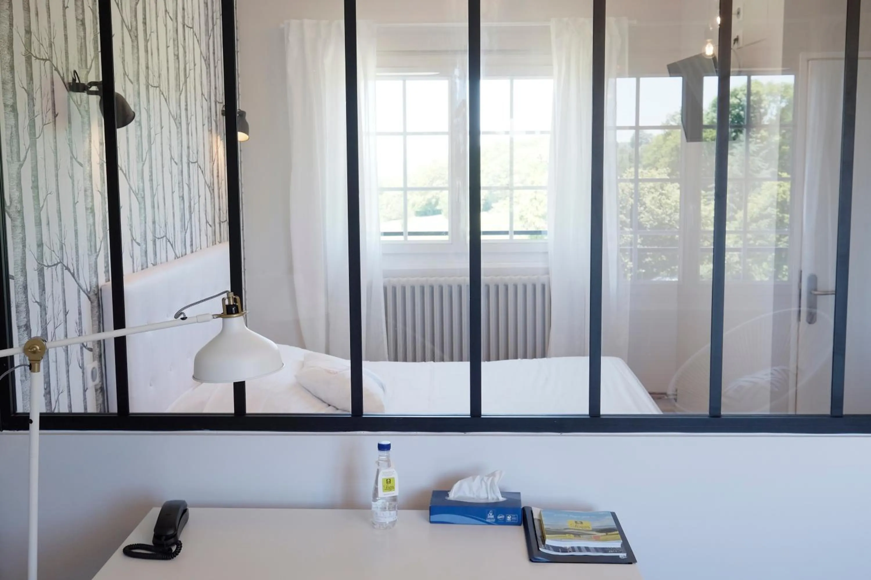 Bed in Logis Hotel Le Relais du Teulet