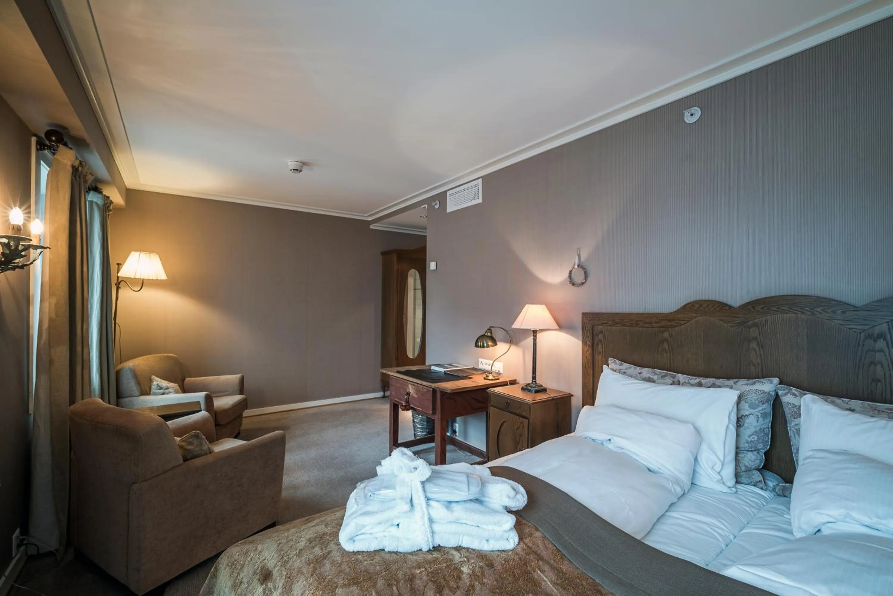 Photo of the whole room, Bed in Angvik Gamle Handelssted - by Classic Norway Hotels