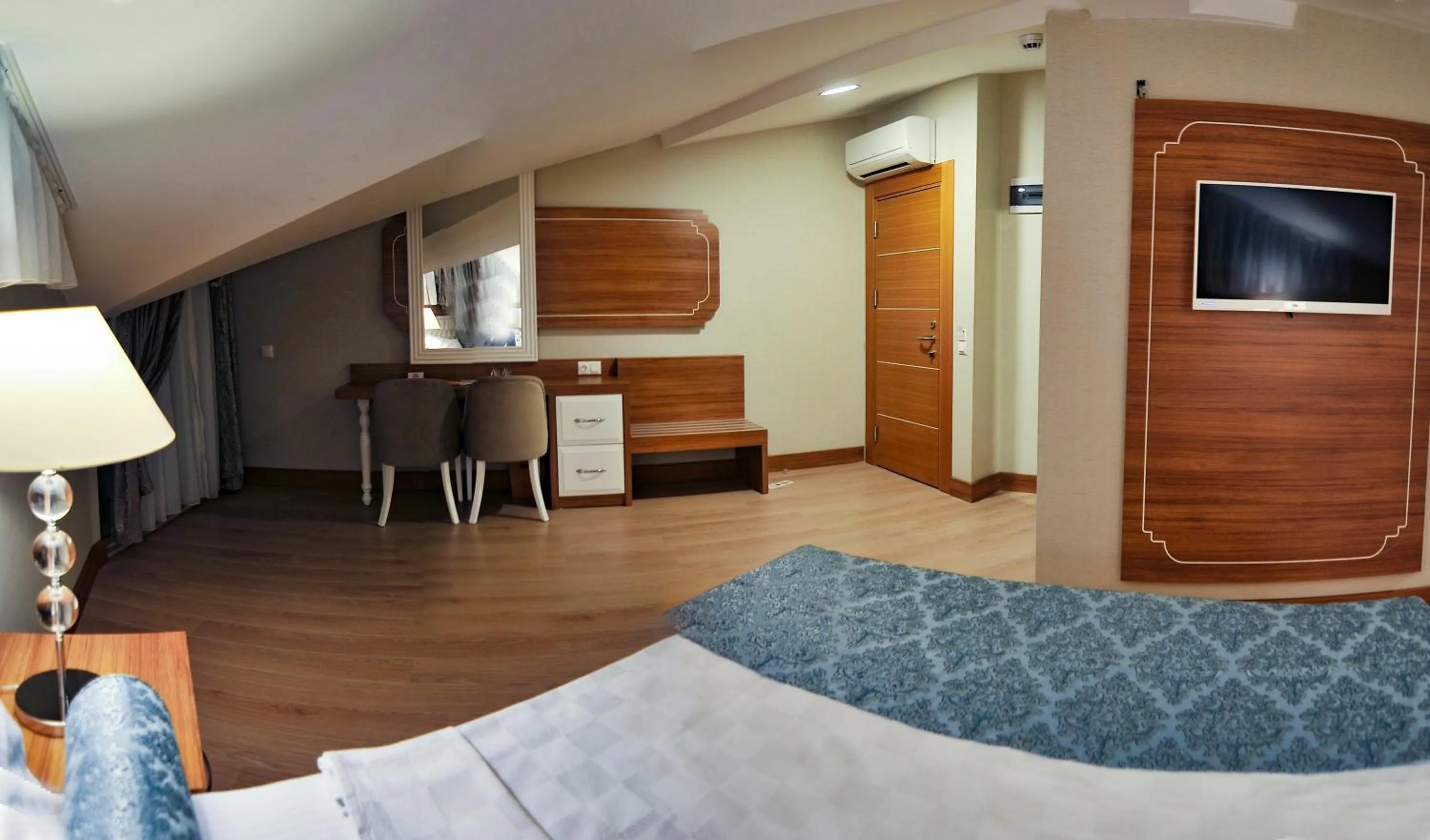 Bed in Exelans Hotel