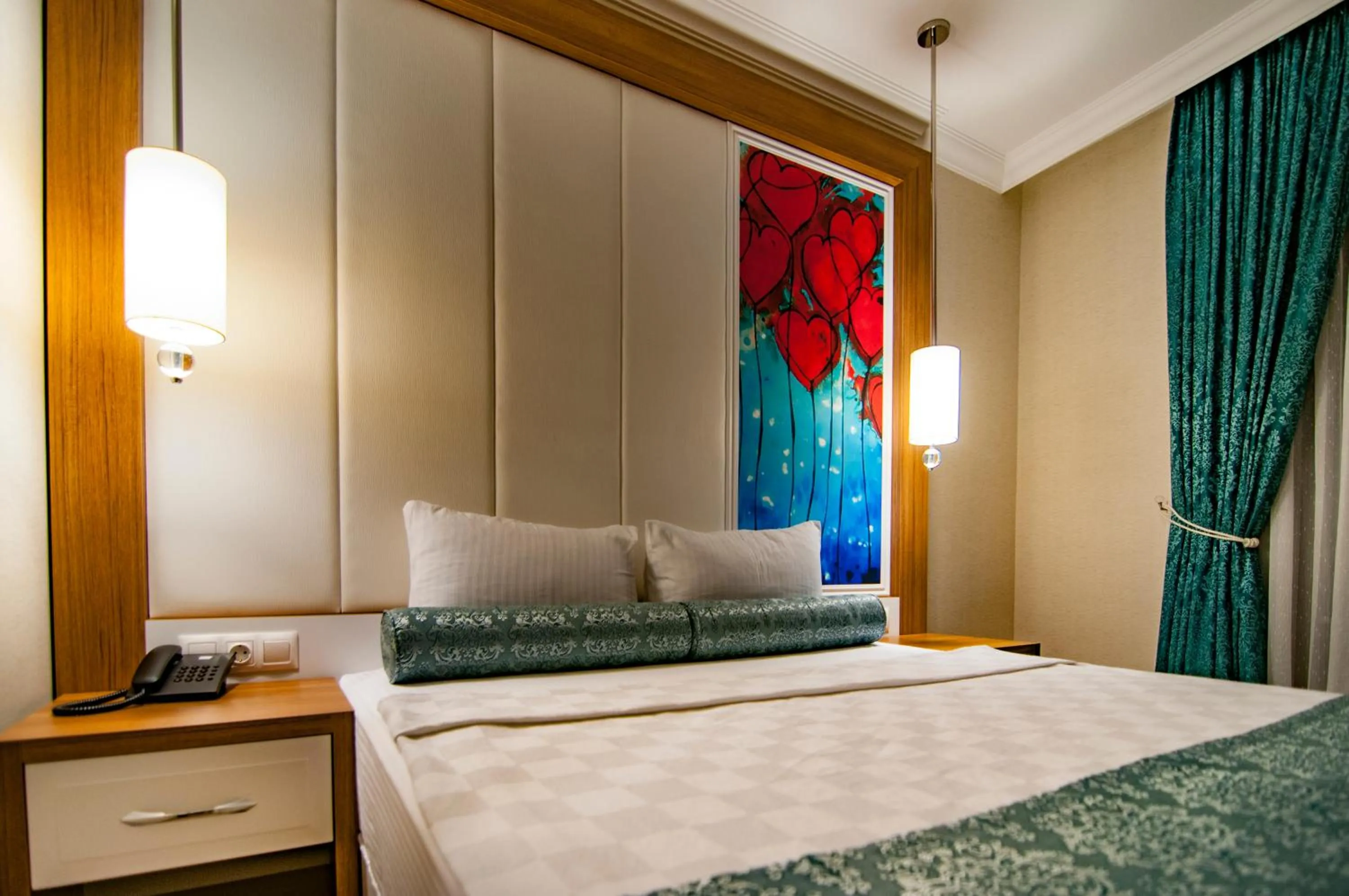 Bed in Exelans Hotel